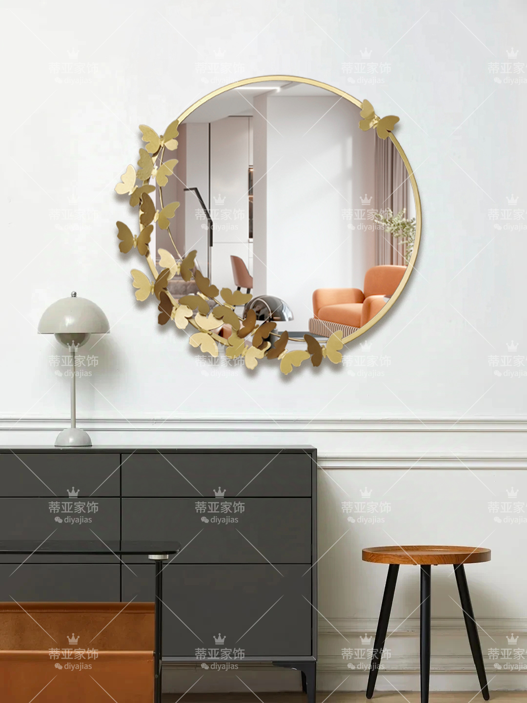 A circular Lu alloy mirror decorated with golden butterflies details Picture