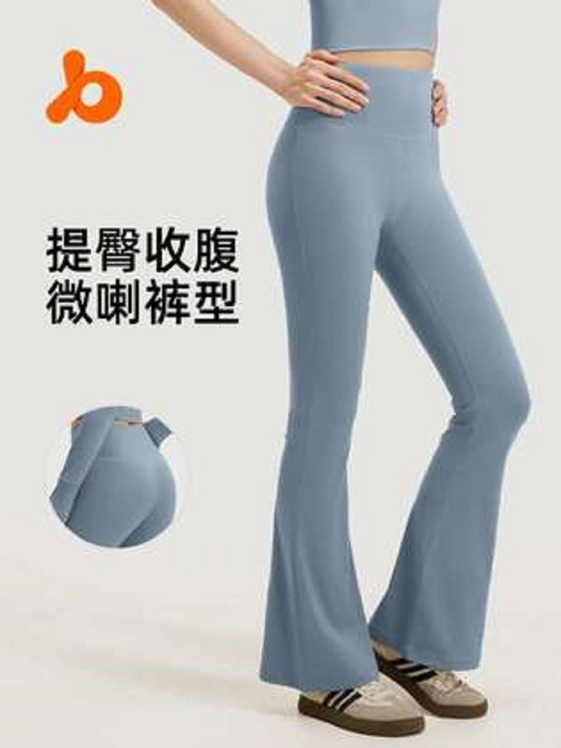 A sports outdoor windbreaker paired with light blue yoga pants that lift the buttocks and tuck in the abdomen
