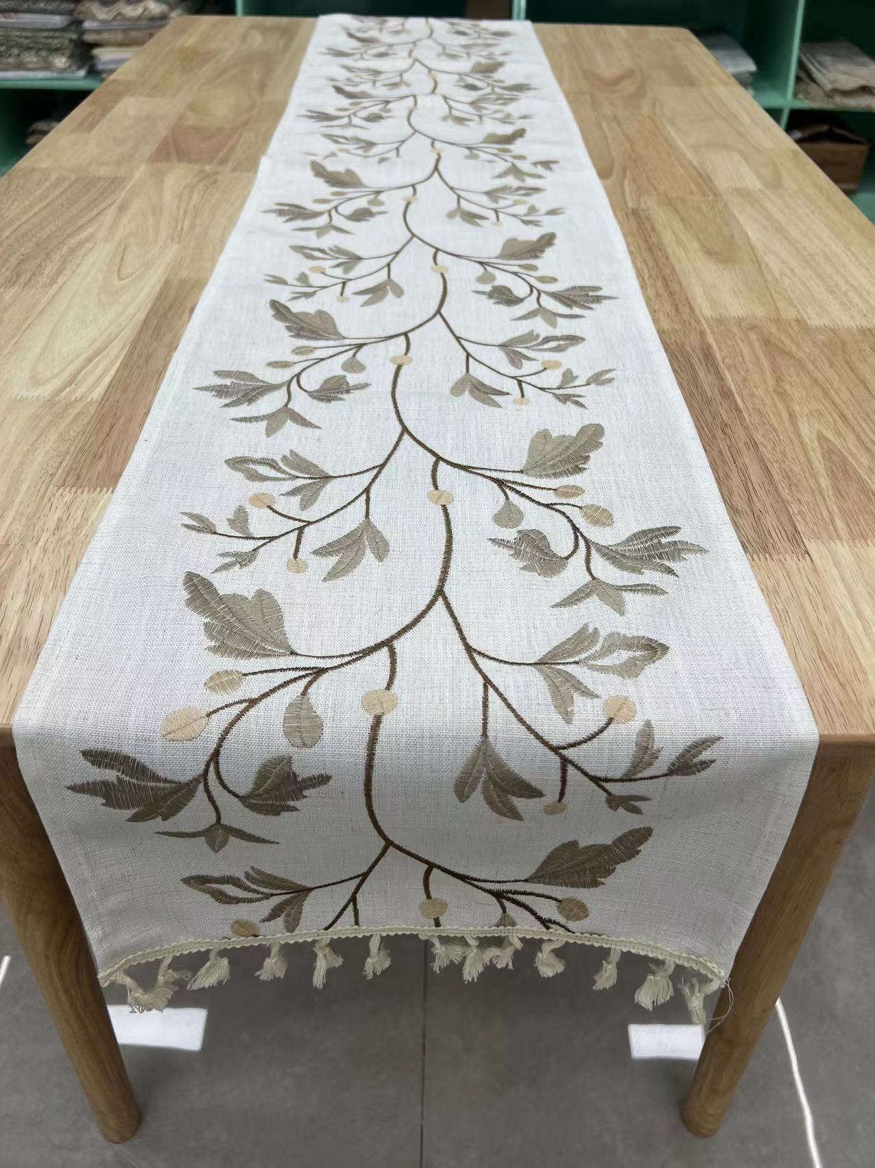The wedding table flag is embroidered on coarse linen