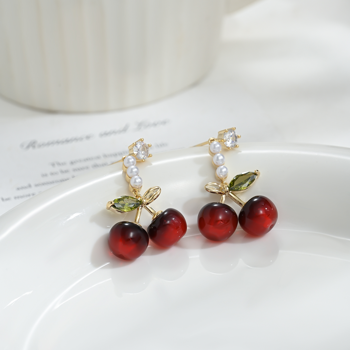 The new, niche and distinctive ear studs in a cherry shape are versatile for daily gatherings Specification image