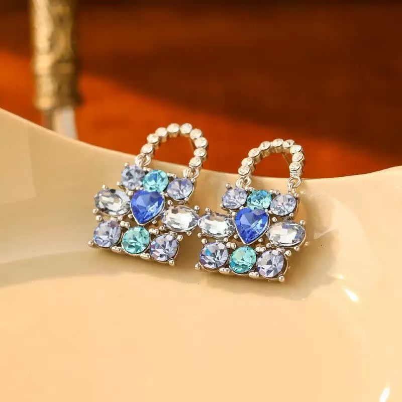 Light luxury, high-end and niche design, blue bag-shaped earrings, fashionable and elegant details Picture