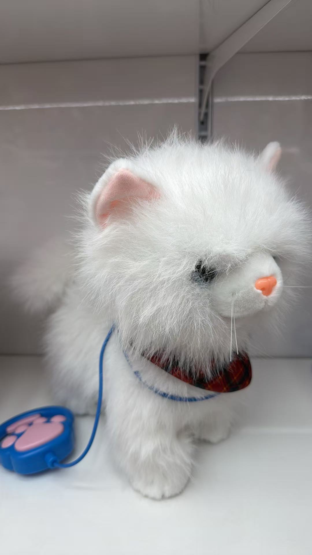A cute and furry plush toy doll with a leash licking its tongue, walking and singing details Picture