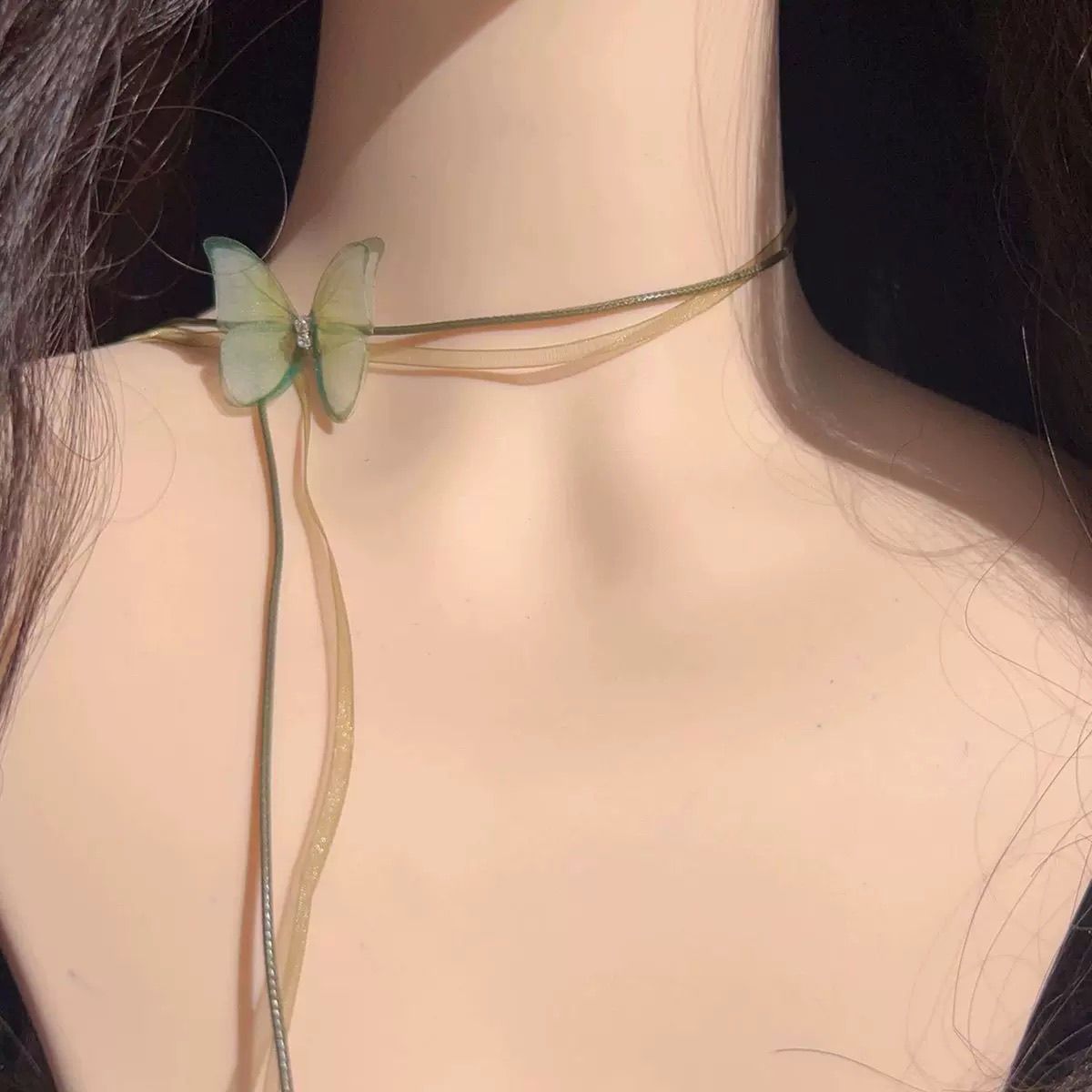 The choker is a unique and ethereal green chiffon butterfly long lace-up neckband with a chic look detail image 4
