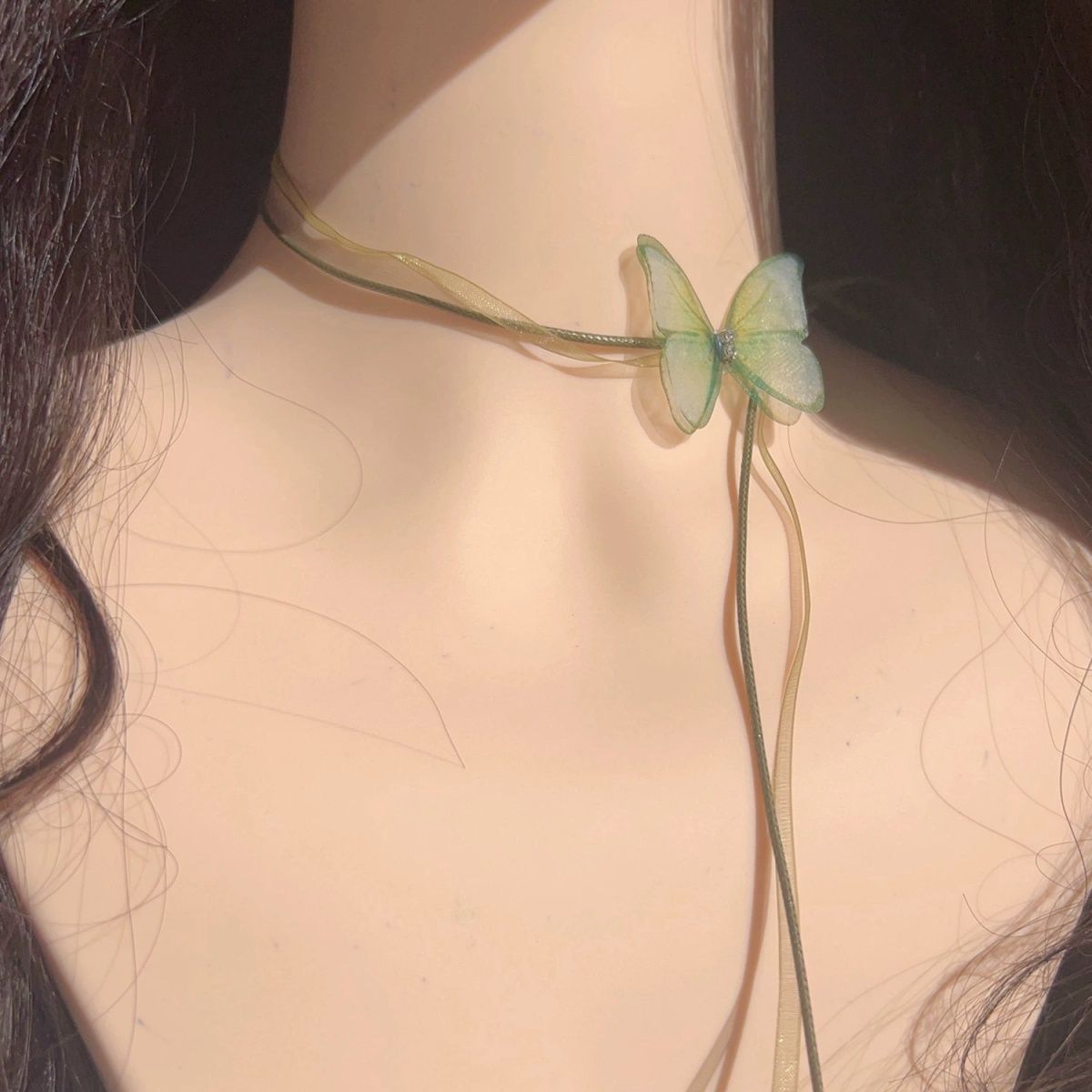 The choker is a unique and ethereal green chiffon butterfly long lace-up neckband with a chic look detail image 5