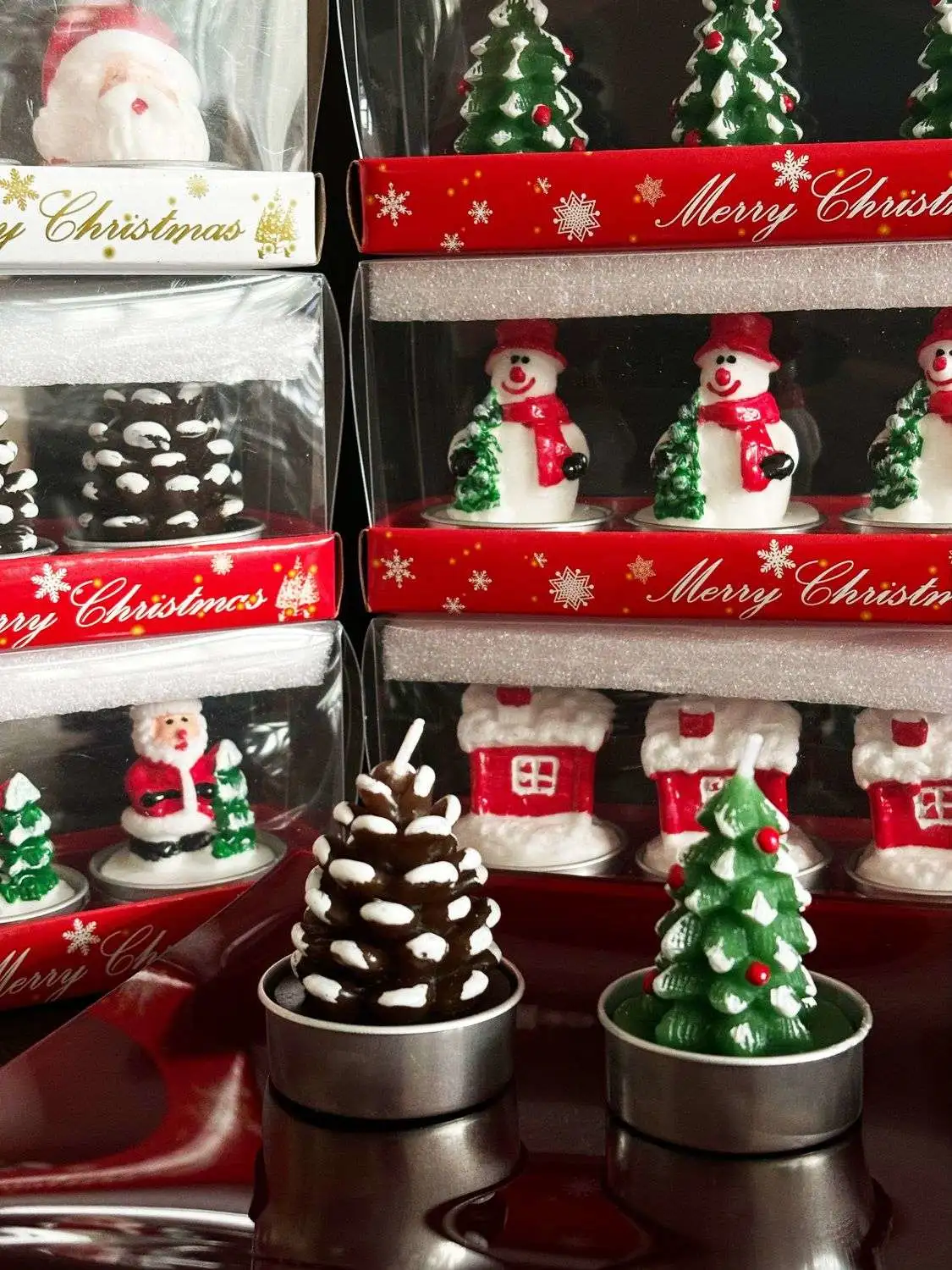 Romantic Christmas Eve gifts decorated with Christmas candles. Cute little aluminum shell-shaped candles for Christmas detail image 4