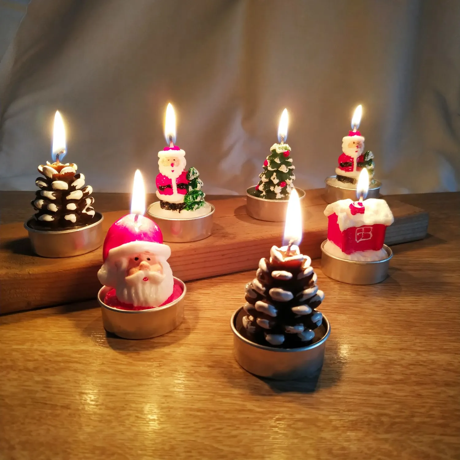 Romantic Christmas Eve gifts decorated with Christmas candles. Cute little aluminum shell-shaped candles for Christmas detail image 3