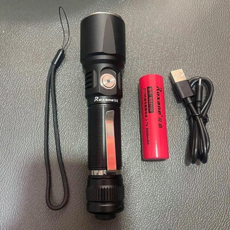 A black high-intensity flashlight with a red battery, a USB charging cable and a purple lamp for banknote inspection