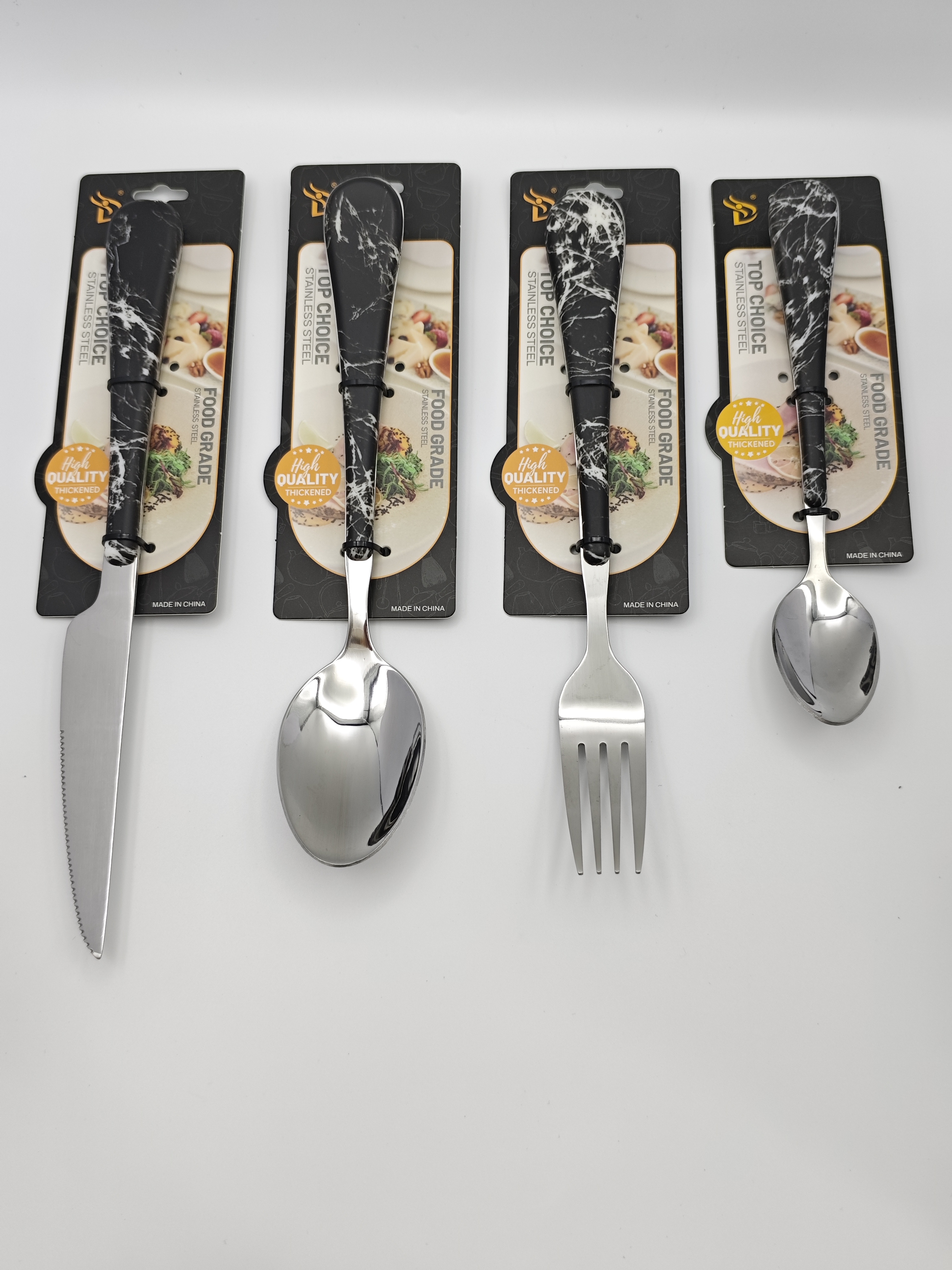 Marble-patterned stainless steel tableware set. Marble-patterned plastic-coated handle stainless steel knives, forks and spoons suitable for restaurants and hotels