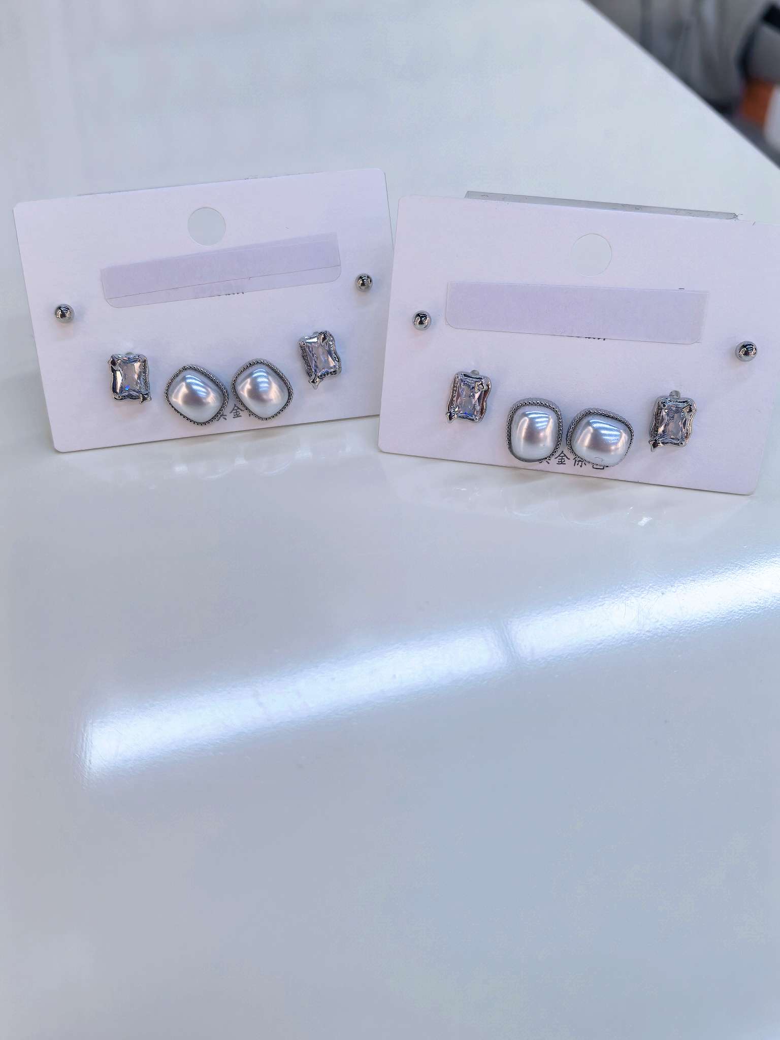 Silver pearl square crystal stud earrings set, three groups with a white background, totaling six pieces
