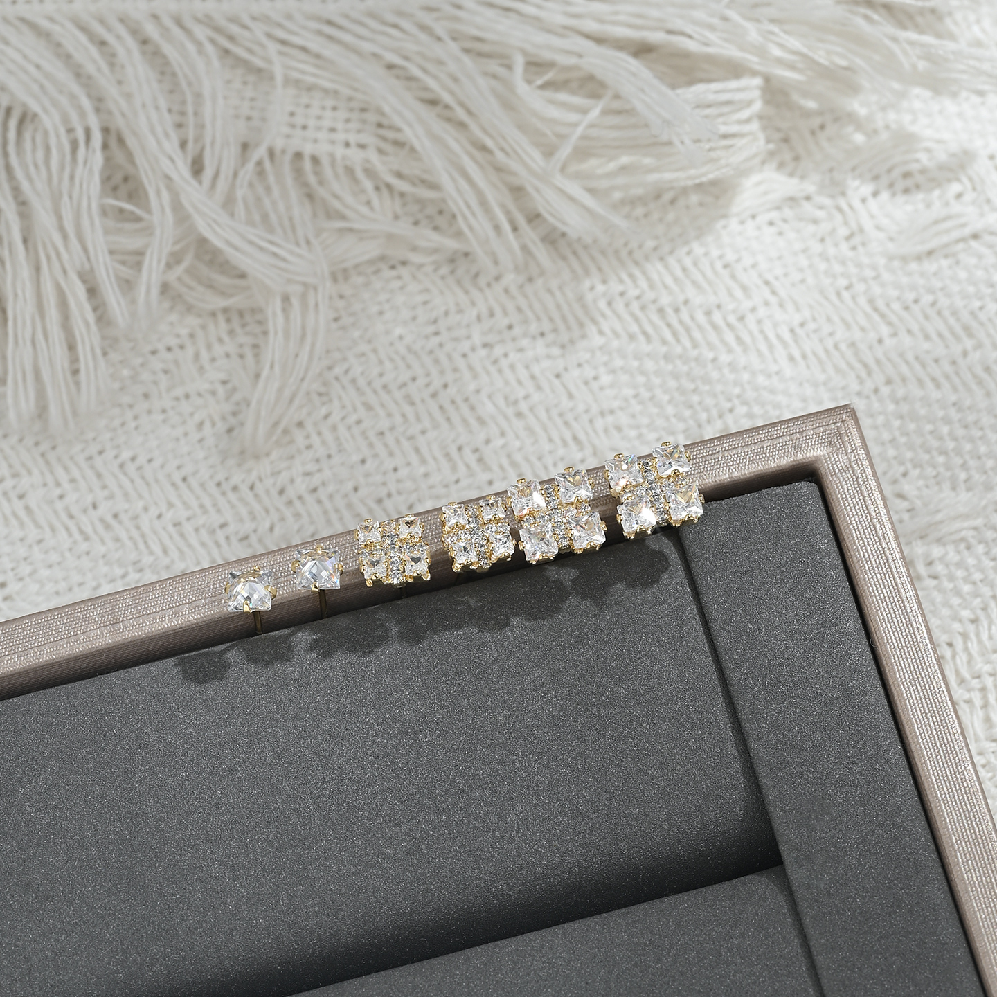 A new, unique and distinctive square white card with three pairs of earrings for daily use Application Scenario