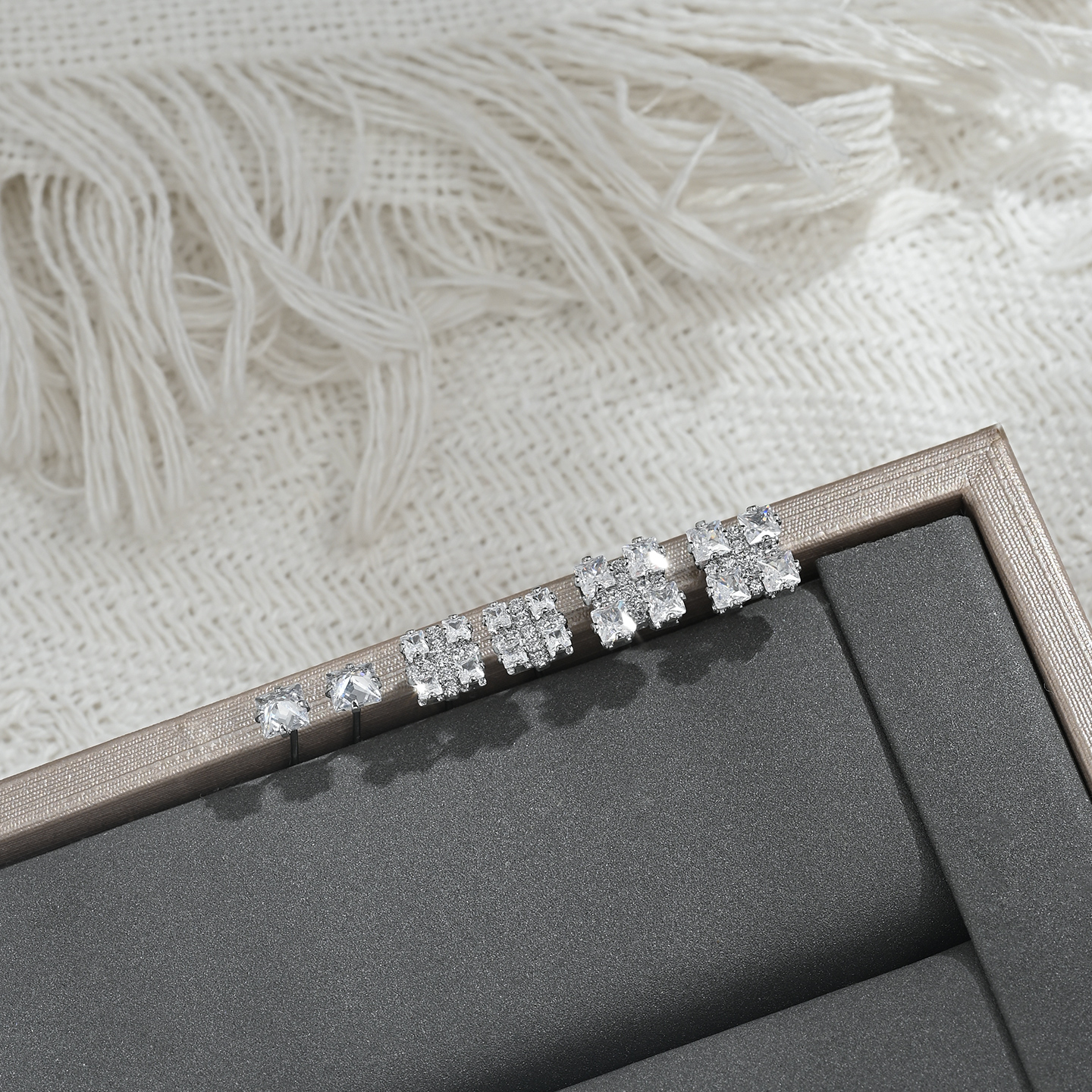A new, unique and distinctive square white card with three pairs of earrings for daily use Item Picture