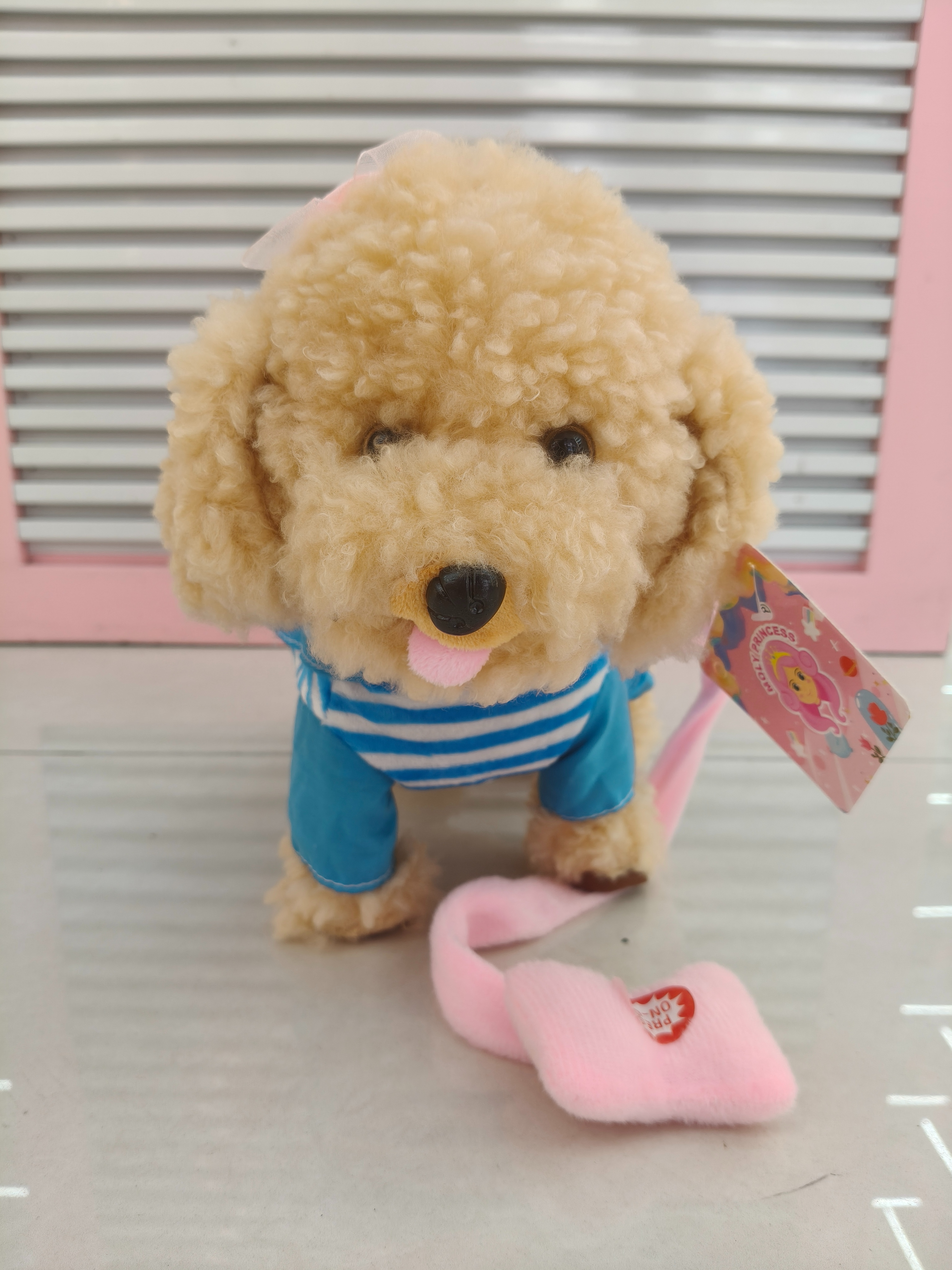 A simulated little dog children's toy with 60 songs and a leash that can walk and lick its tongue details Picture