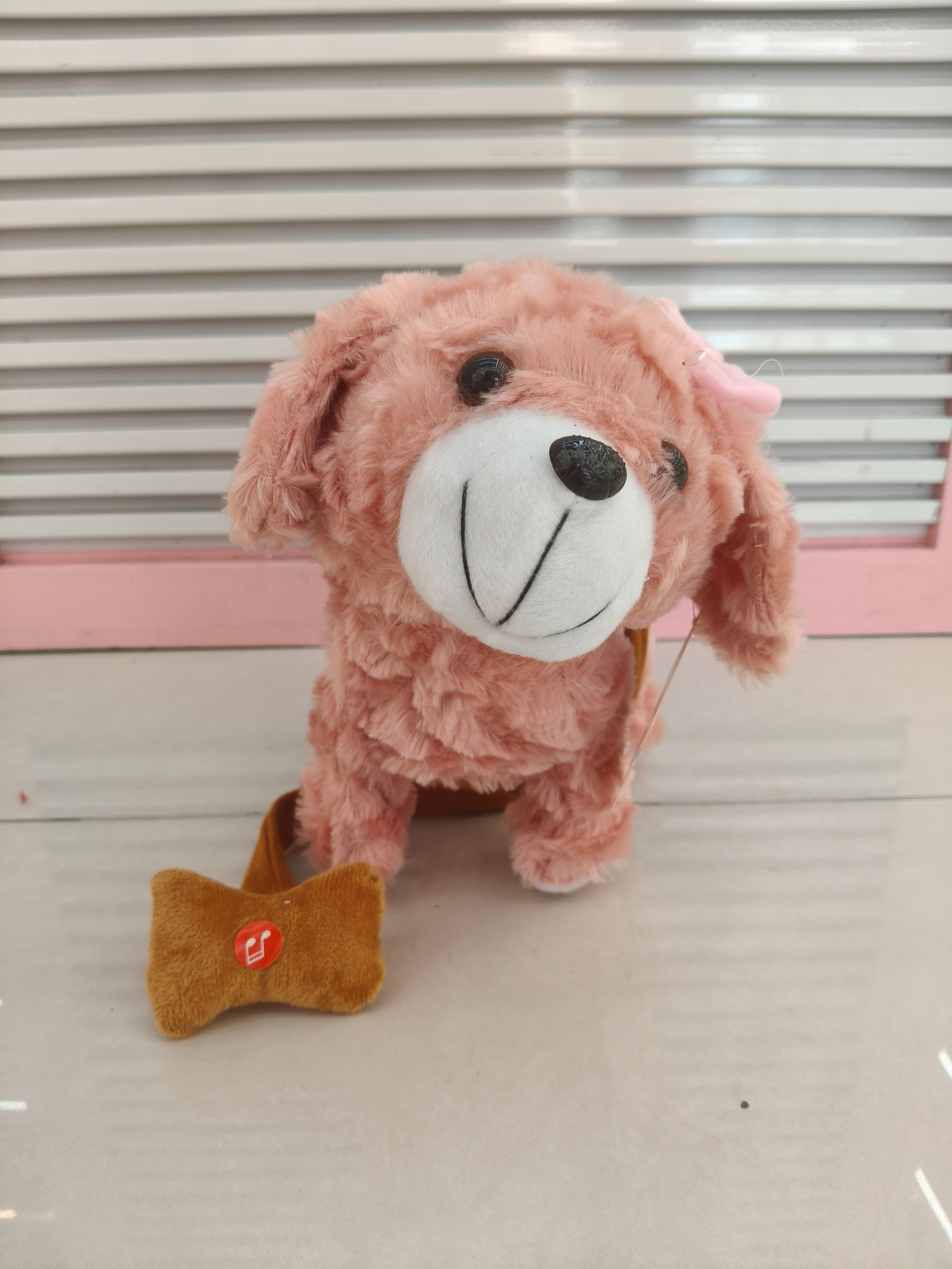A life-sized colorful children's toy with a walking, tongue-licking, leash and 60 songs details Picture