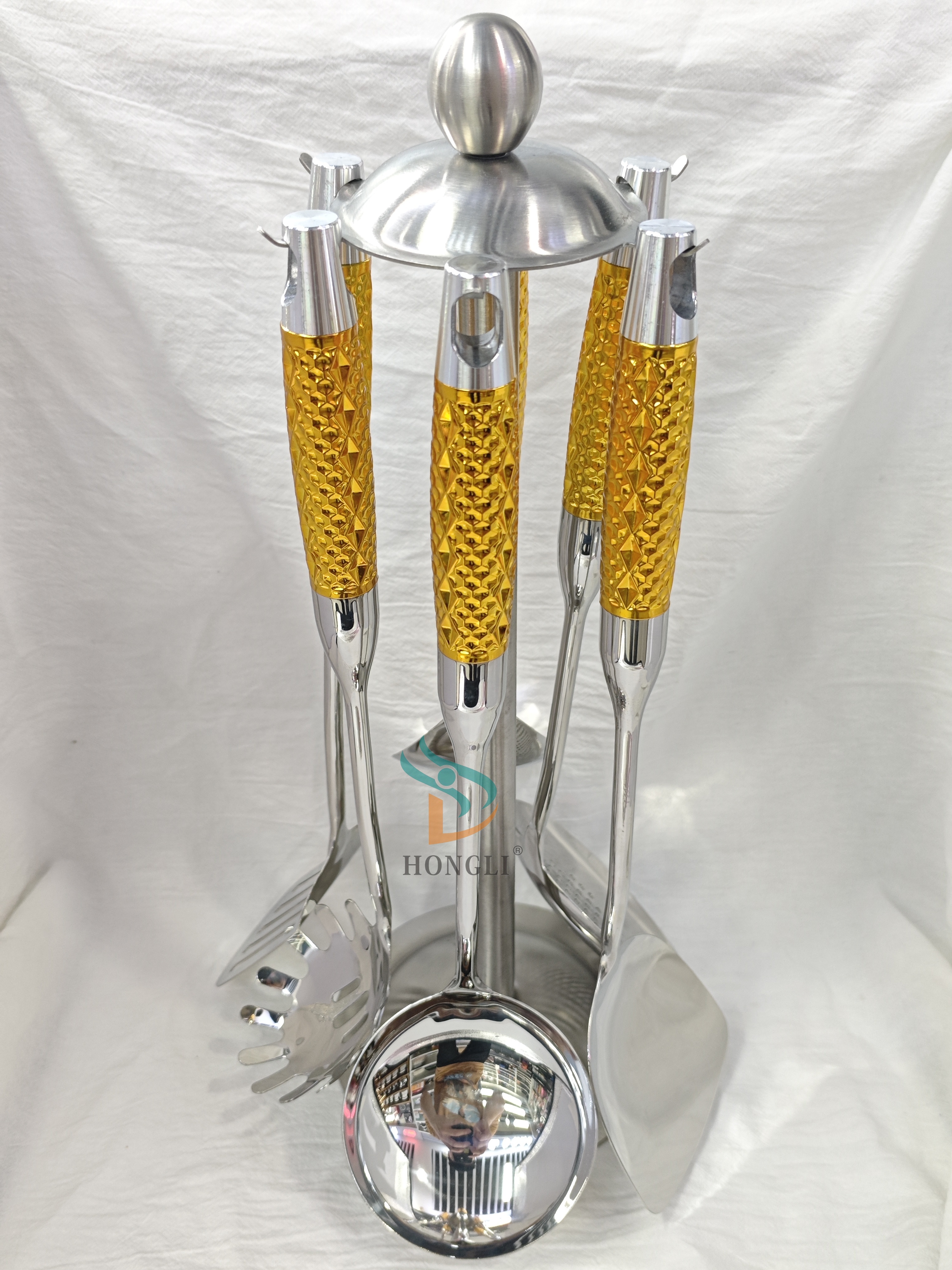 Septr Silver metal kitchenware set with golden-textured handles and storage hangers, stainless steel mirror-polished soup spoons and stir-frying spatulas