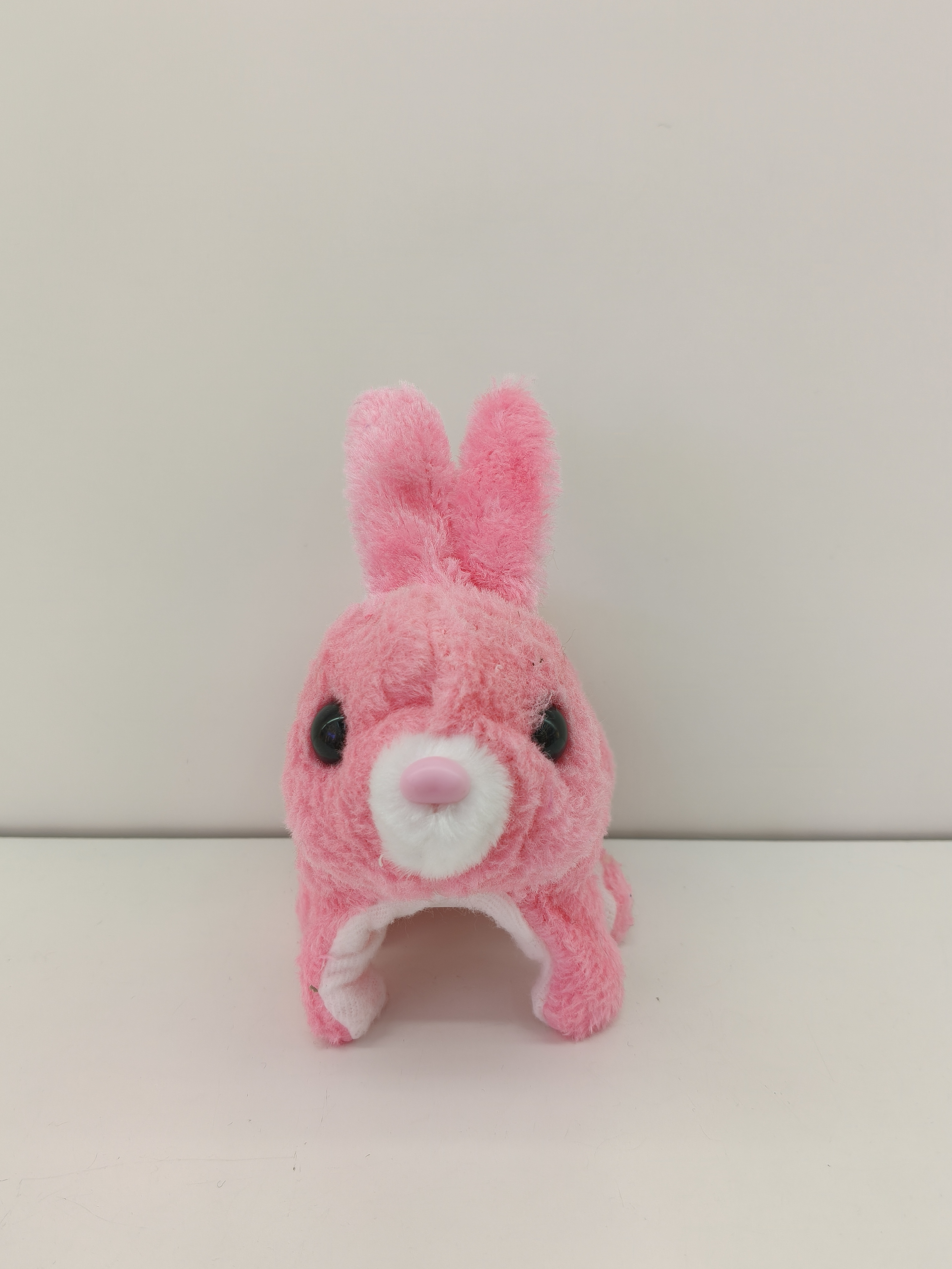 The red-eyed colorful rabbit can walk, make sounds and has bright eyes. It's a plush toy of a colorful puppy, a cute puppy toy for children Item Picture