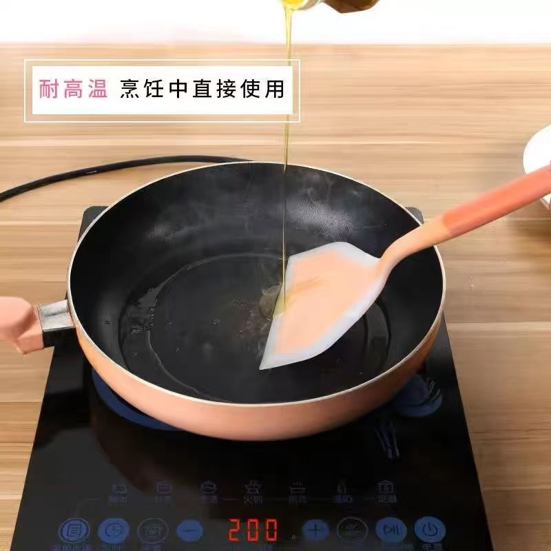 四孔铸铁雪花纹平底煎锅 黑色锅身橙色手柄配硅胶铲
