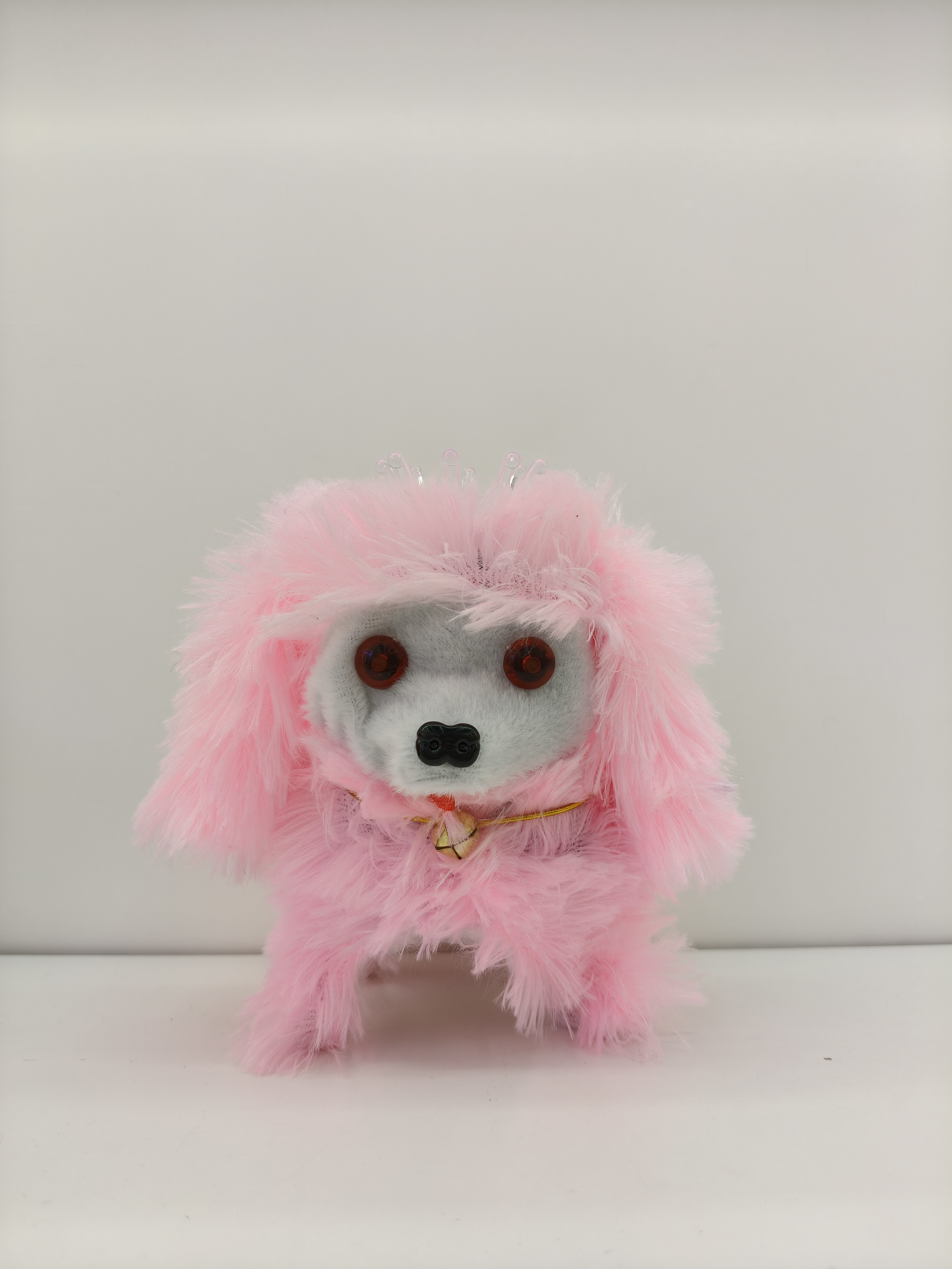 The Crown Dog can walk and bark. It has a crown on its head and is a cute multi-colored toy puppy Specification image