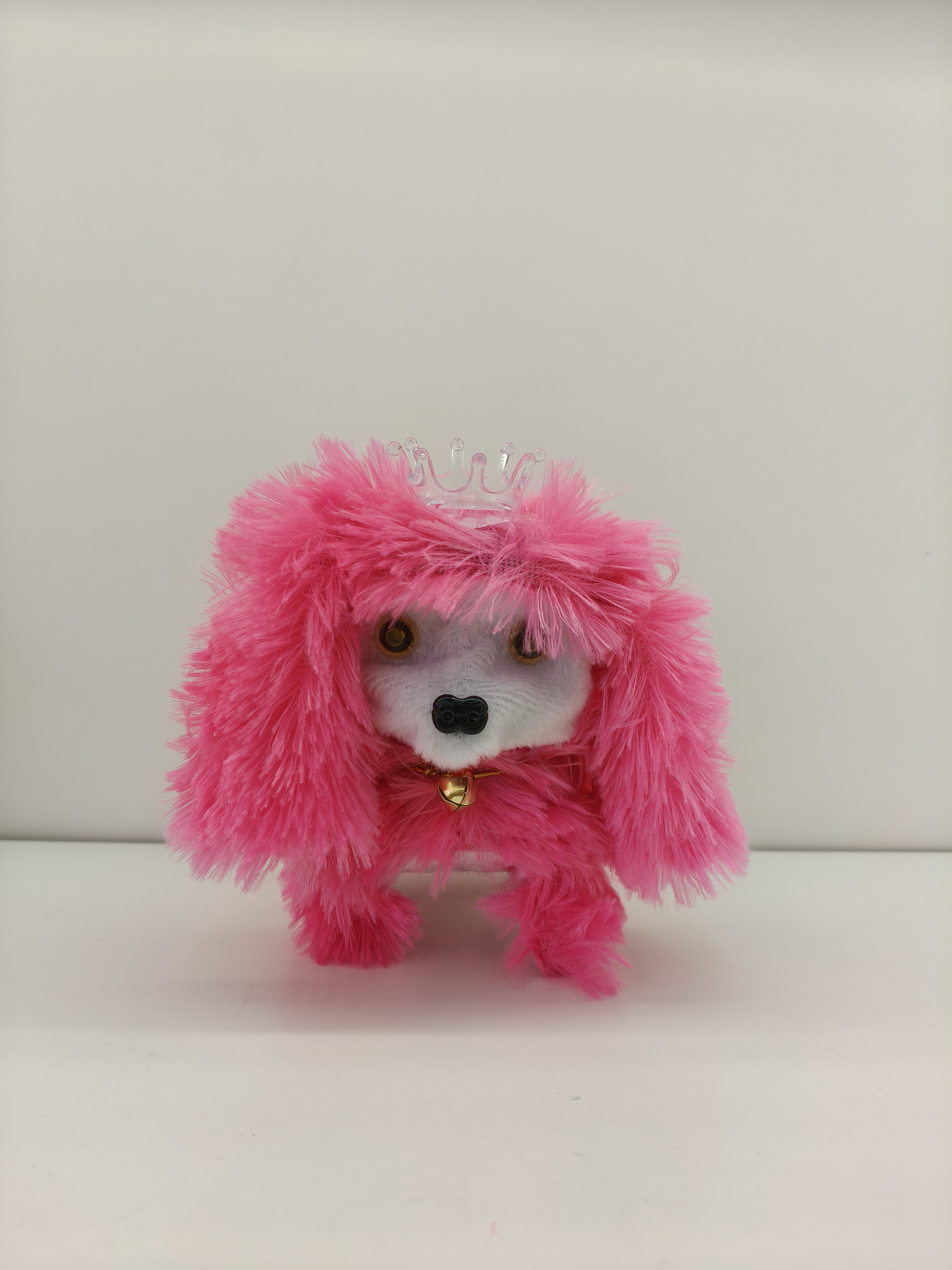 The Crown Dog can walk and bark. It has a crown on its head and is a cute multi-colored toy puppy details Picture