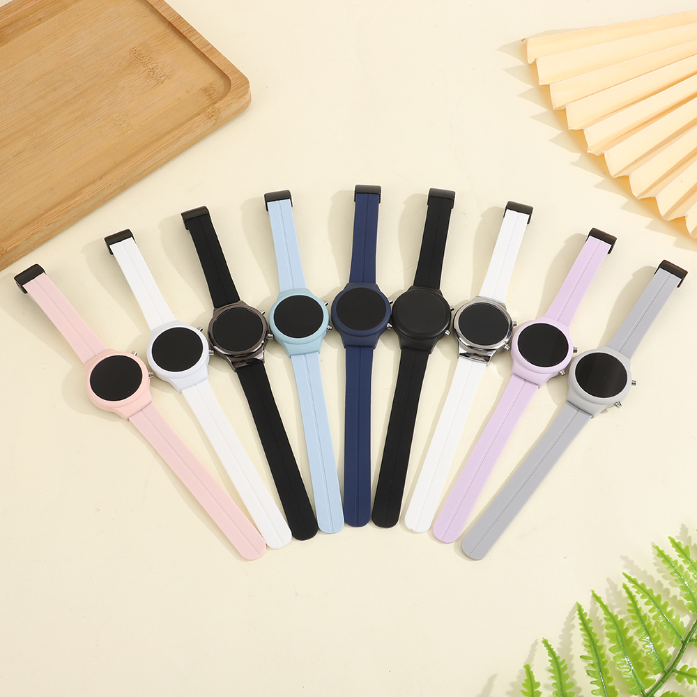 This color LED electronic watch is designed for students and is suitable for both men and women. It features a simple circular digital display with clear luminous time and date. The silicone strap and skin-friendly magnetic clasp make it easy to wear. It is a simple, versatile and elegant electronic watch