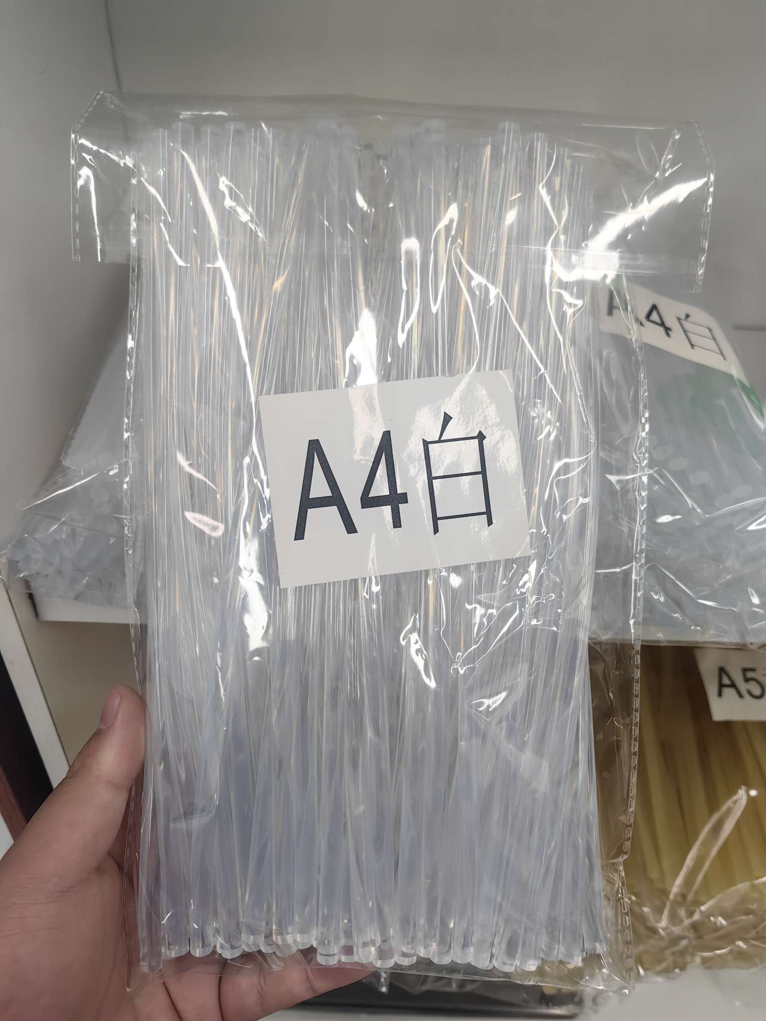 White hot melt glue sticks in transparent plastic bags are made of universal EVA material and are heat-resistant details Picture