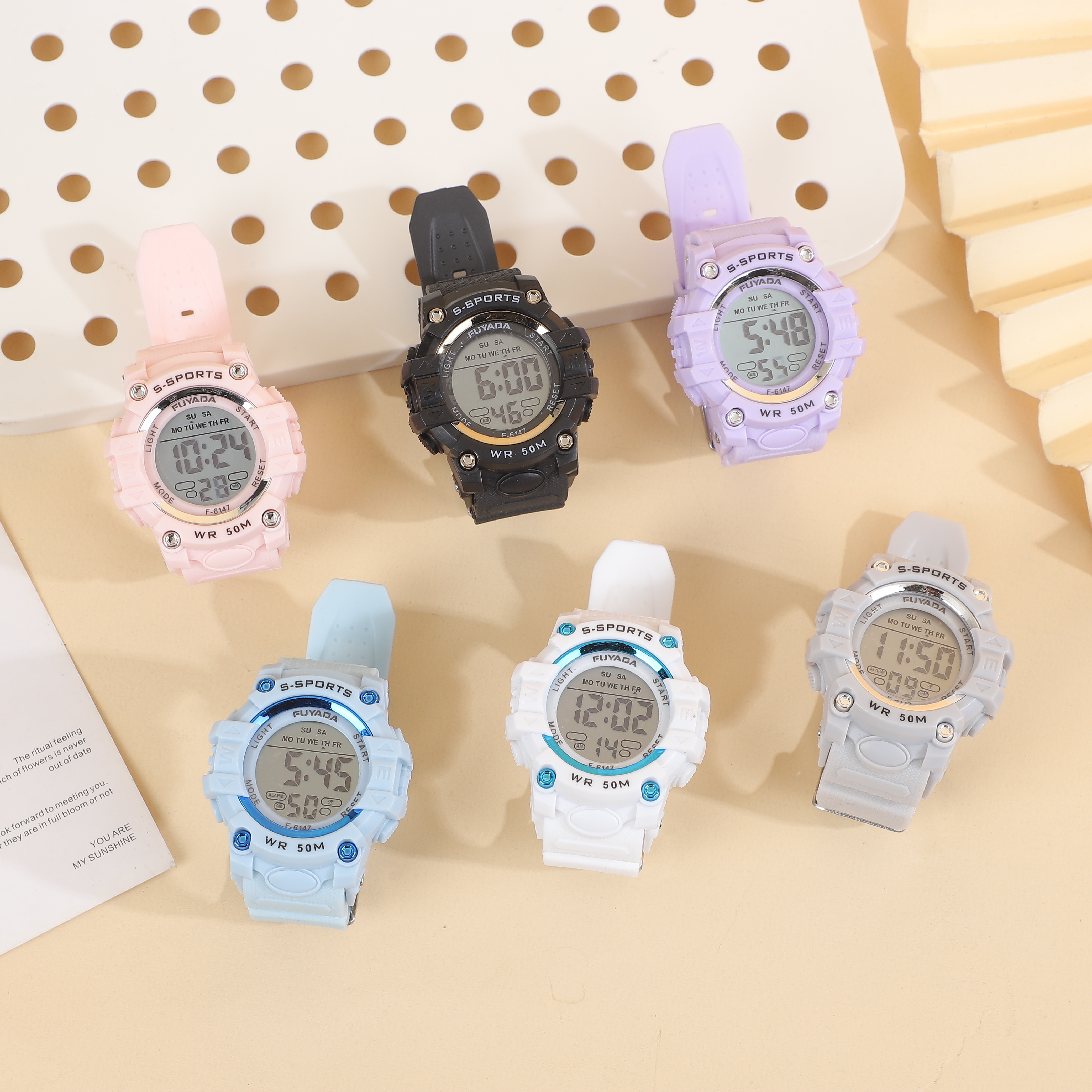 The FUYADA electronic sports watch is 50-meter water-resistant. It is a versatile electronic watch that can be worn for daily washing and swimming. It features a luminous alarm clock for timing. It is suitable for both boys and girls on campus and is a student electronic sports watch