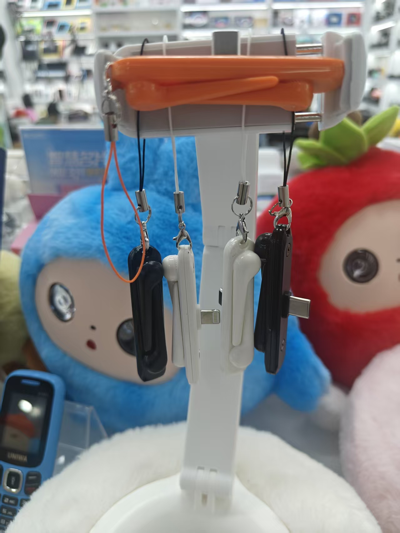 Orange, white and black multi-color mobile phone charging port converter pendant Specification image