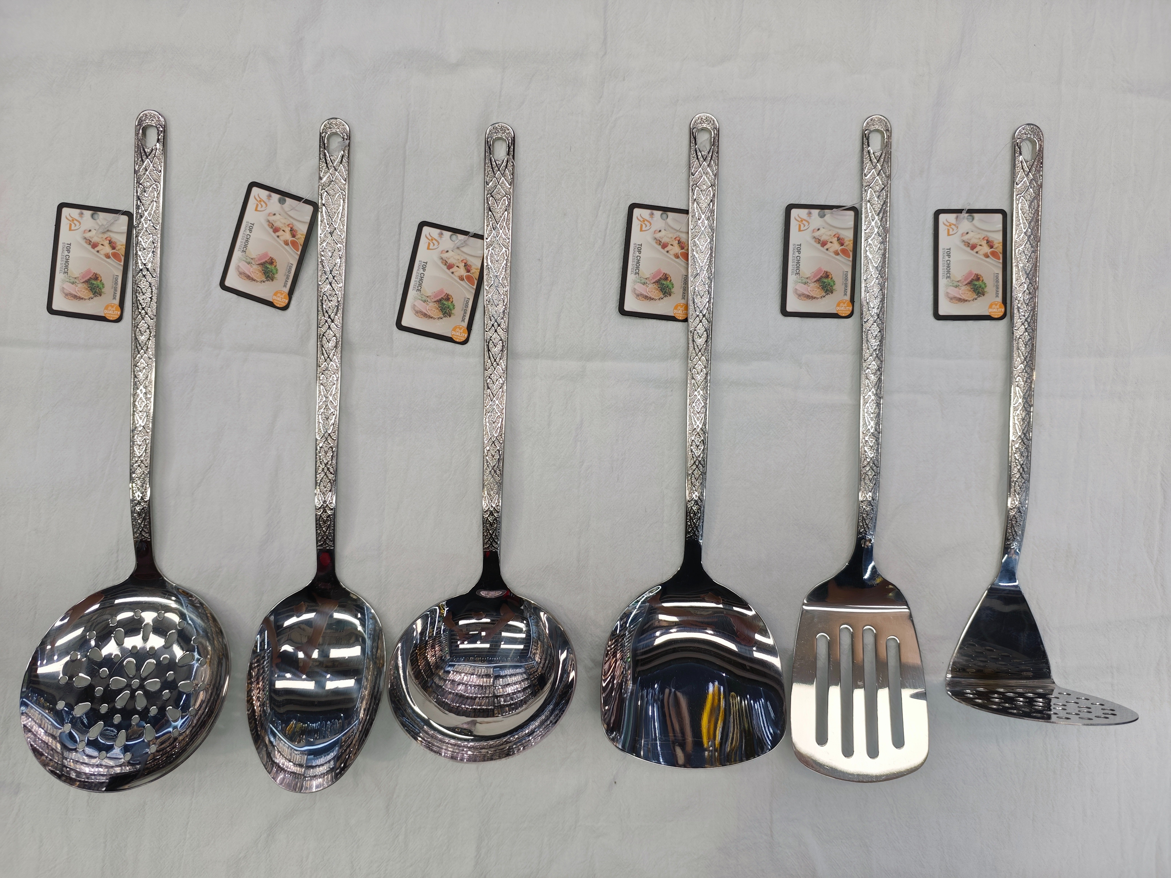 Silver carved long-handled soup spoon and strainer set