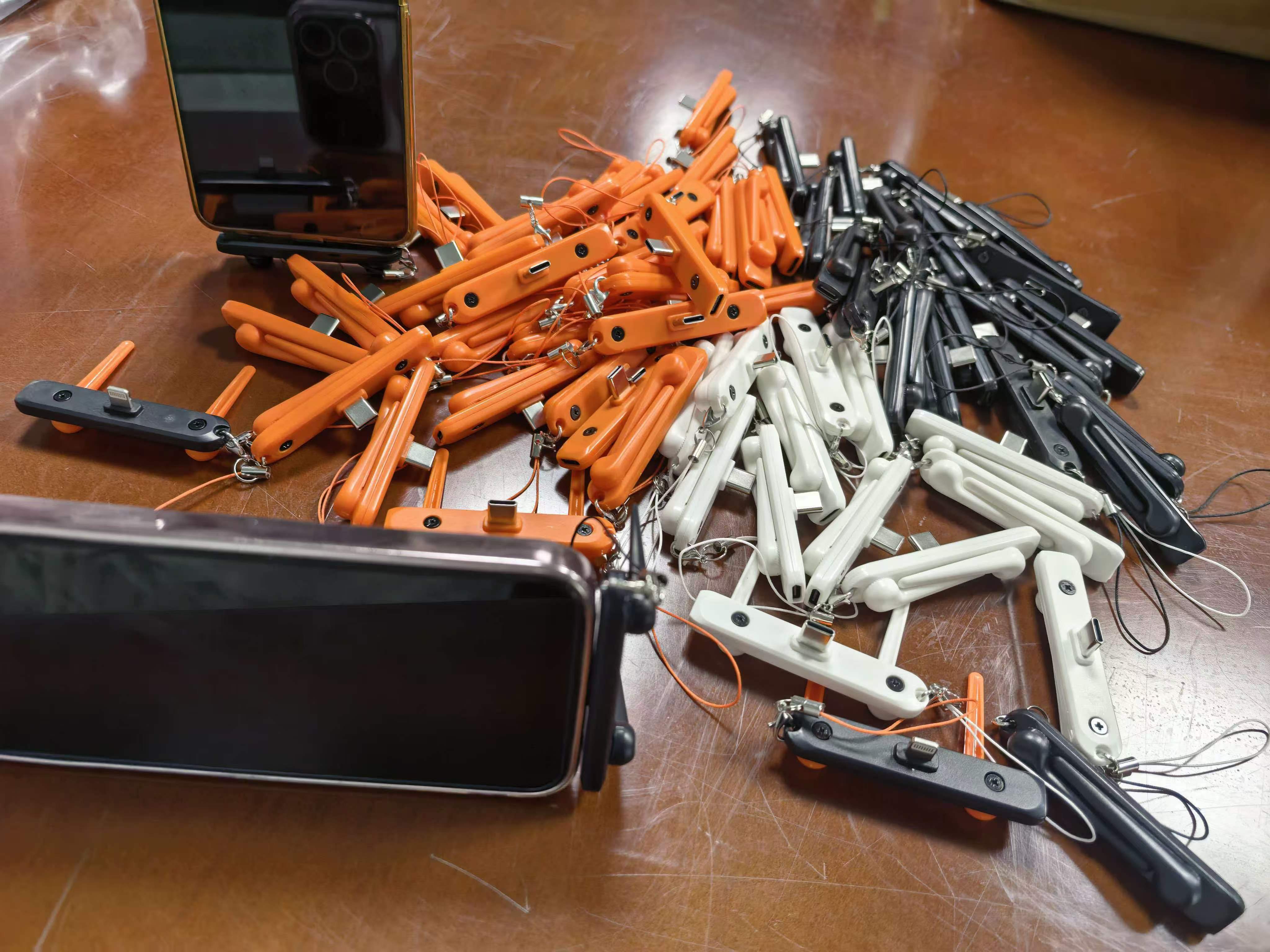 Orange, white and black multi-color mobile phone charging port converter pendant
