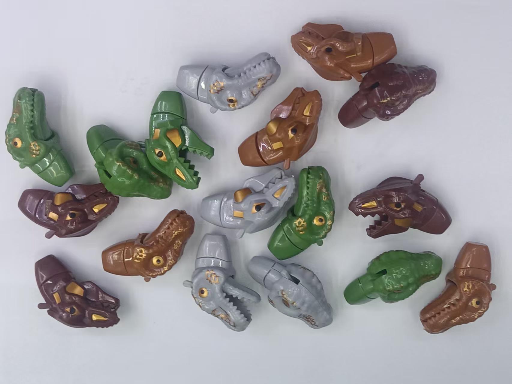 Two small dinosaur heads in four colors with mouth-opening dinosaur heads, creative mouth-opening crayon toys Item Picture