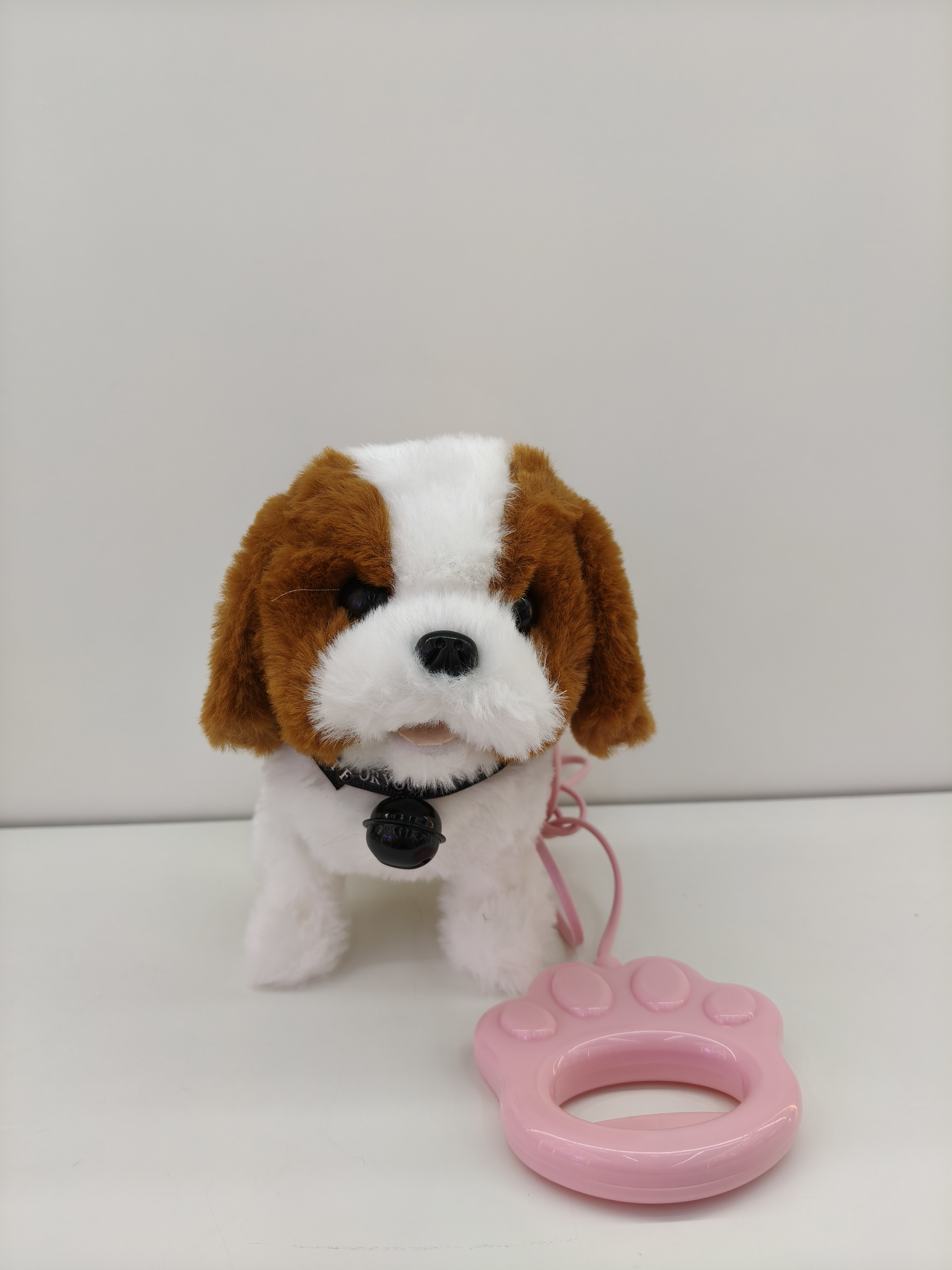 The toy dog will bark when it walks. It is a children's simulated electric plush puppy with a handle Item Picture