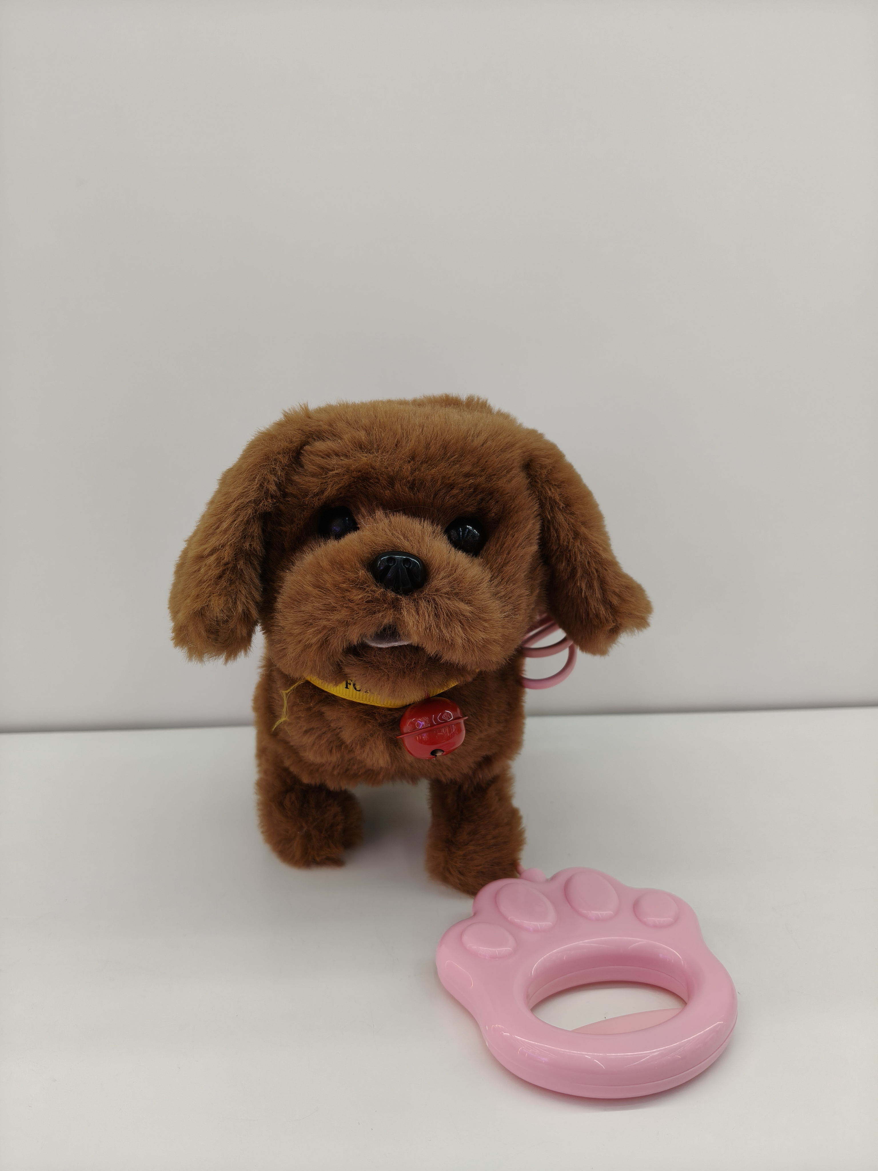 Four plush puppy toys, brown, light brown, pink and white with collars, bells, pink claw-shaped leash, pet toys details Picture