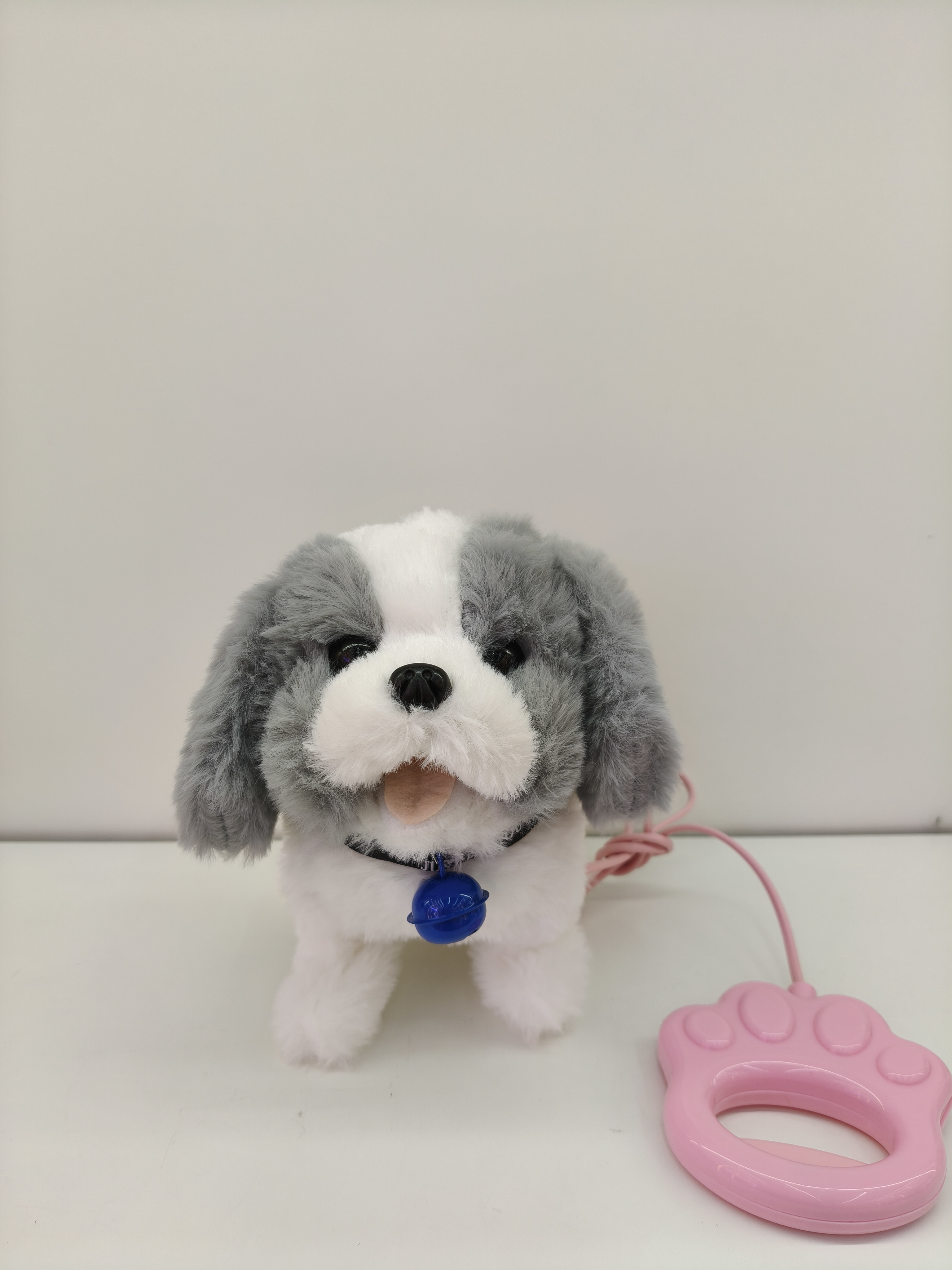 The toy dog will bark when it walks. It is a children's simulated electric plush puppy with a handle Specification image