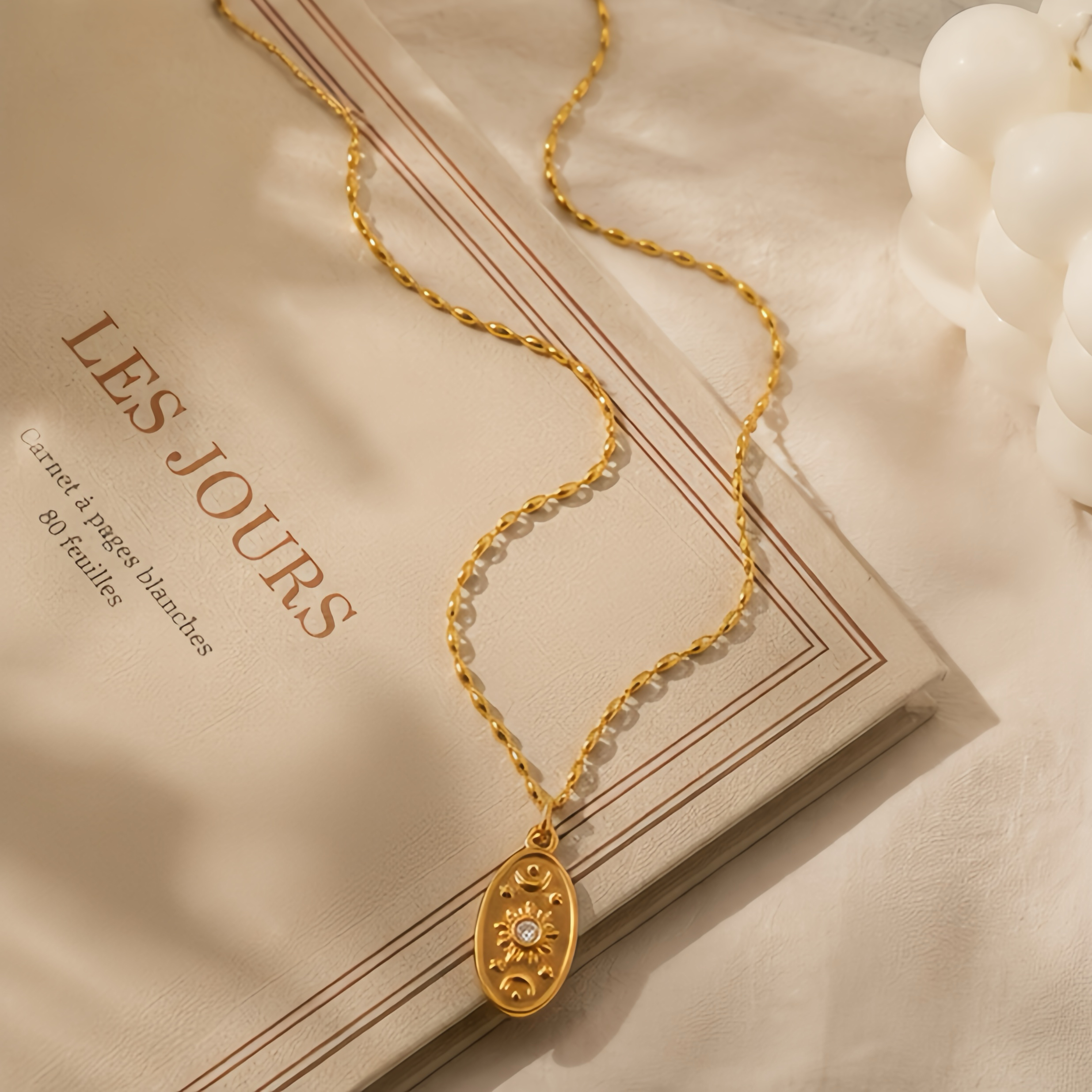 An oval, aged, embossed star, sun and moon, diamond-encrusted pendant, stainless steel, retro design, European and American street style, a unique and distinctive long collarbone necklace Application Scenario