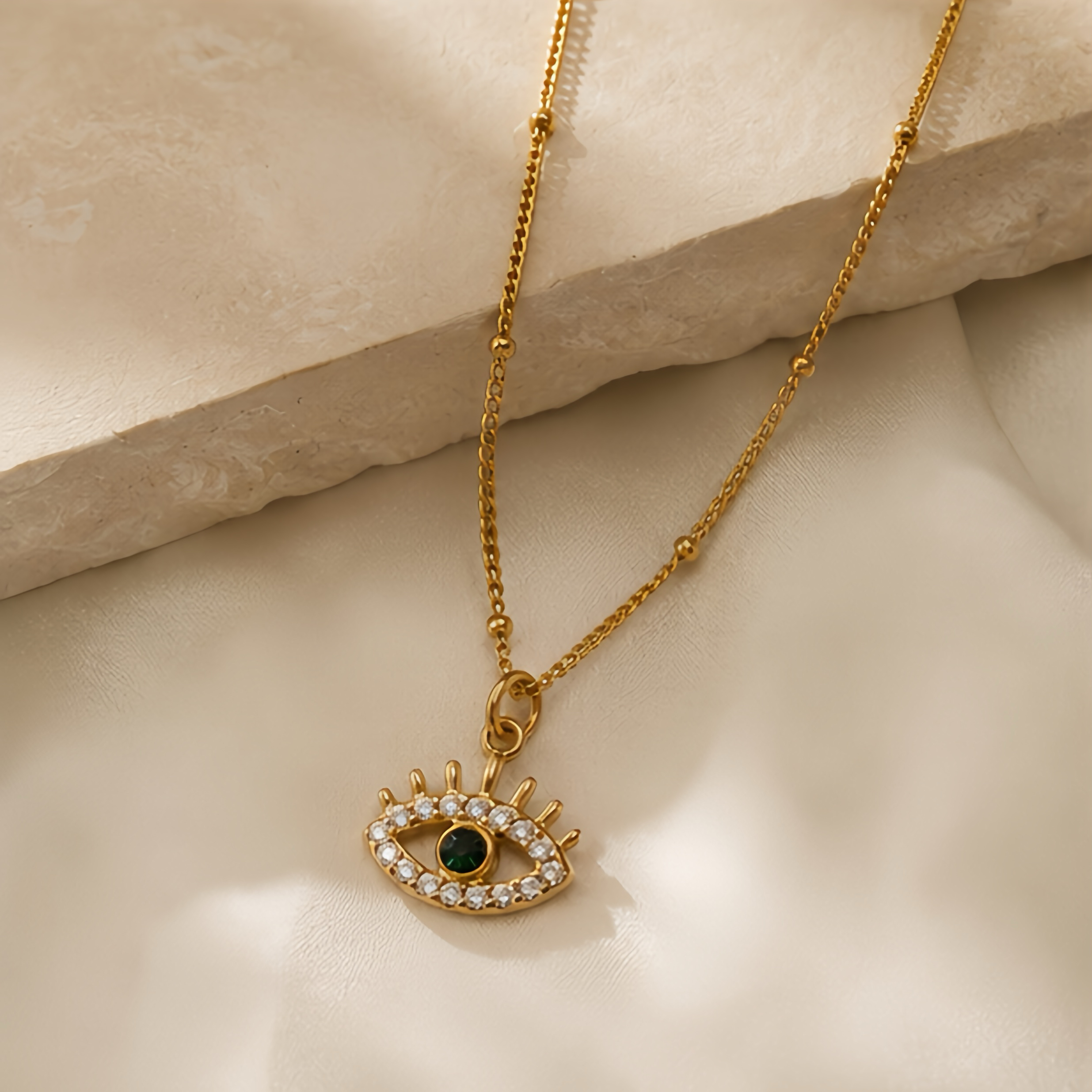 Hollowed-out devil's eye green diamond pendant, a unique street style in the Middle East, a niche long stainless steel decorative necklace full image
