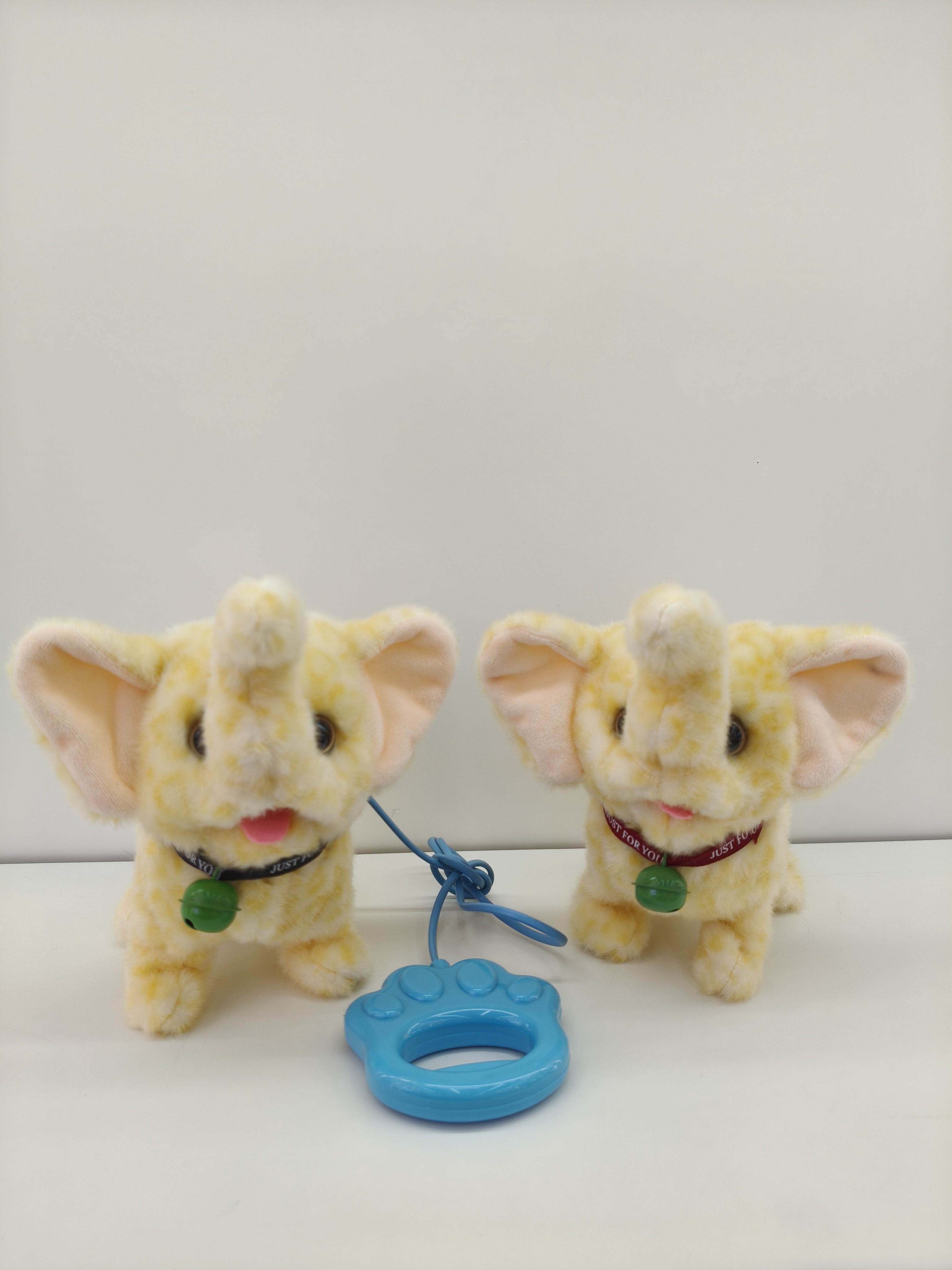 Electric baby elephants can walk, bark, and come with a leash. They are children's toys in various colors full image