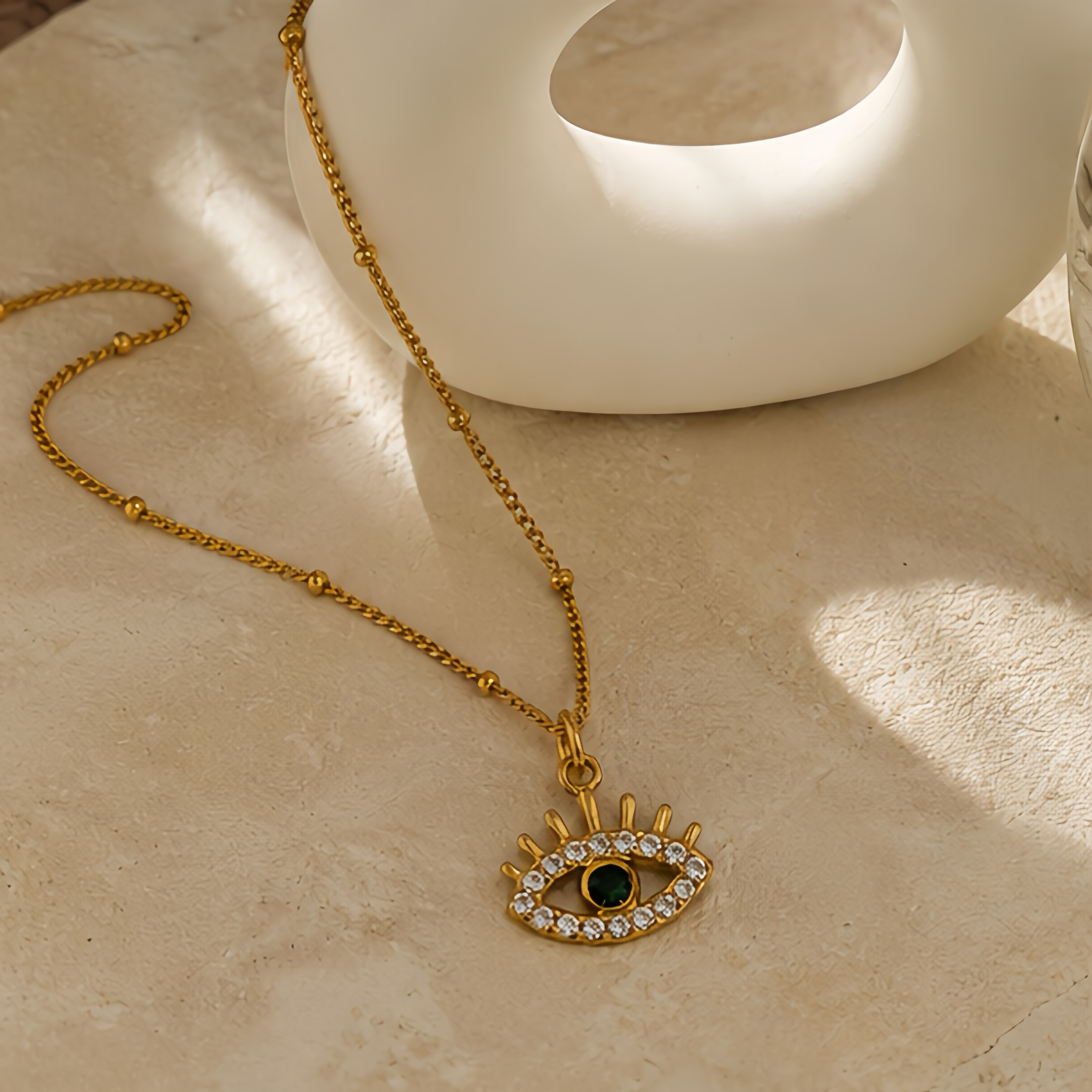 Hollowed-out devil's eye green diamond pendant, a unique street style in the Middle East, a niche long stainless steel decorative necklace details Picture
