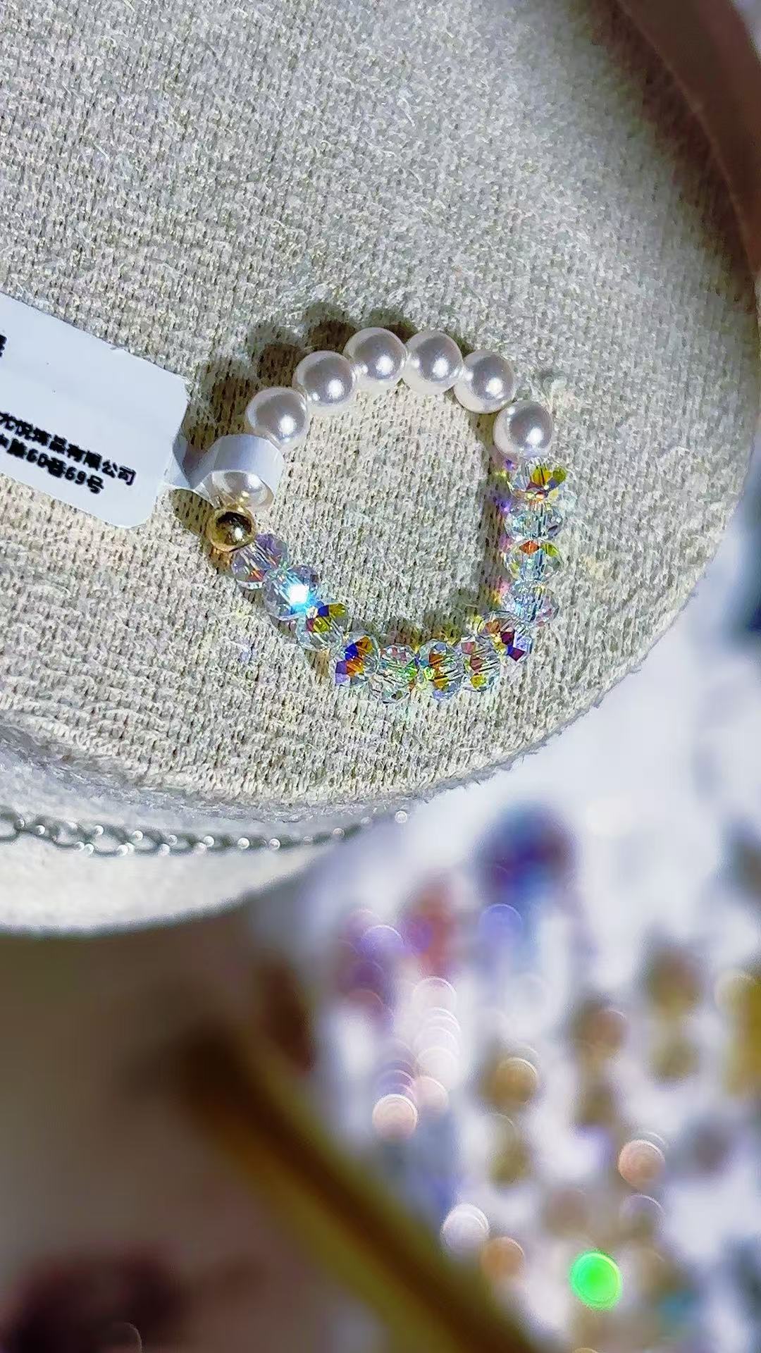A white beaded bracelet inlaid with rainbow crystals and pearls, a titanium steel bracelet for men Application Scenario