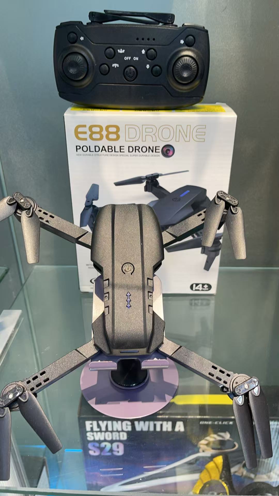 The E88 black folding drone is a lightweight and portable aerial photography device with an intelligent remote control, offering an extremely high cost-performance ratio Specification image