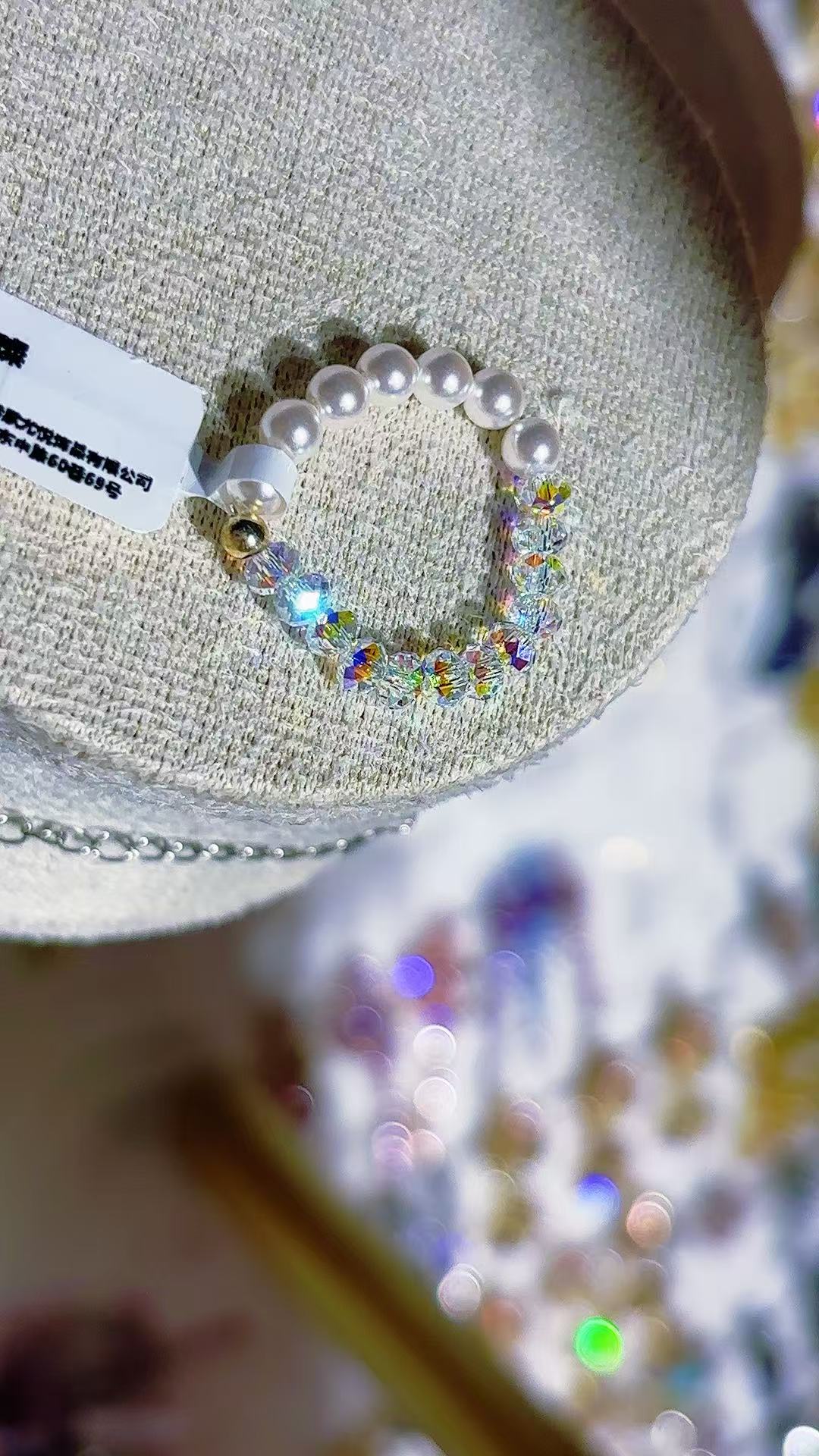 A white beaded bracelet inlaid with rainbow crystals and pearls, a titanium steel bracelet for men details Picture