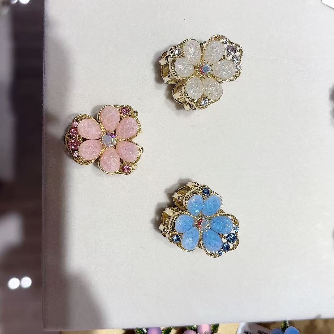 Golden flower-shaped shark clip, pink, white and blue crystal hair accessory gripper details Picture