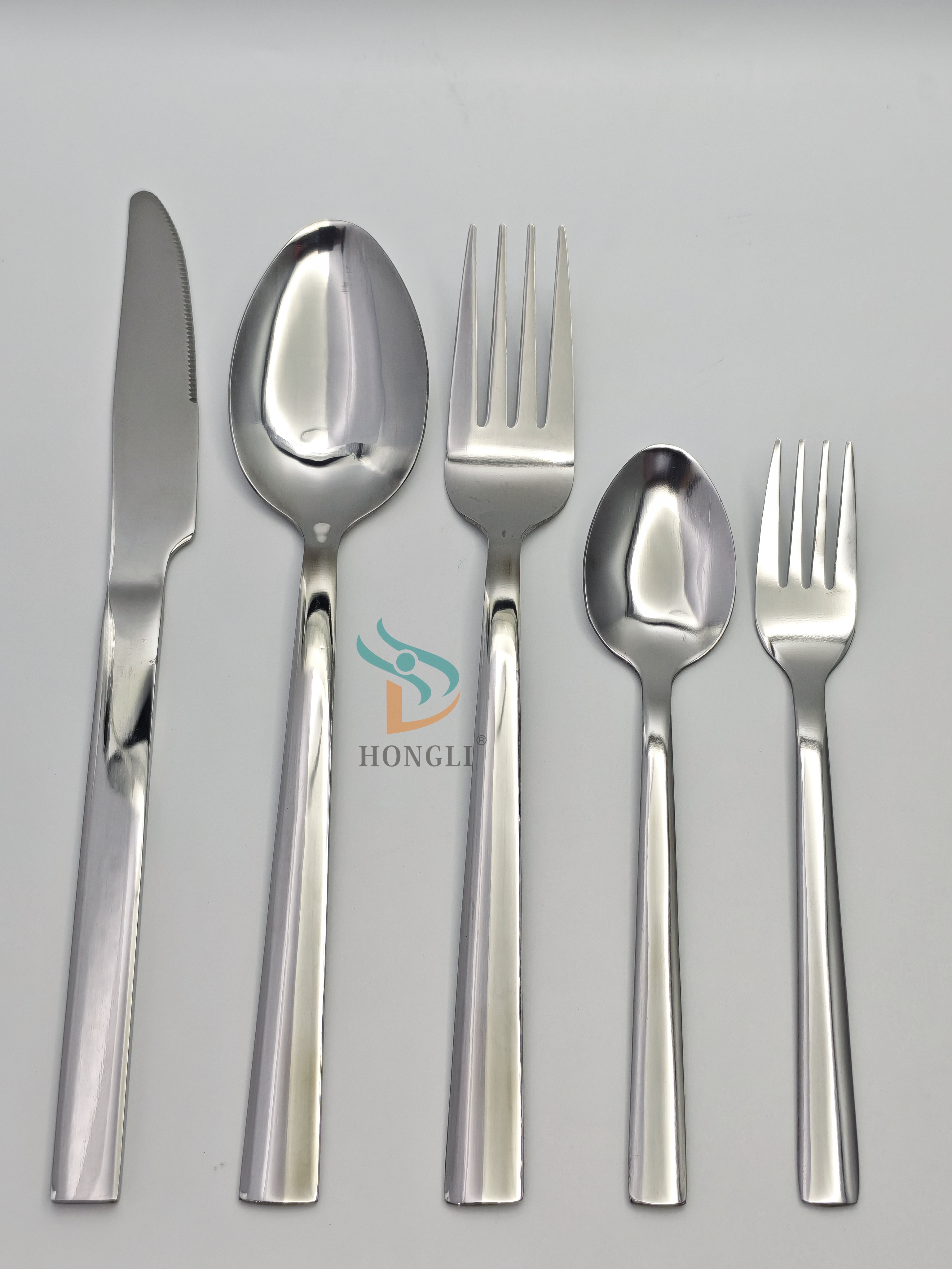 Silver metal stainless steel tableware set of five pieces, including knives, large spoons, large forks, small spoons, small forks, hotel knives and forks