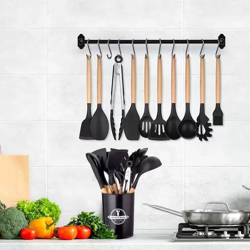Black wooden-handled silicone kitchenware set with storage cylinder, available in multiple colors. Kitchen silicone kitchenware