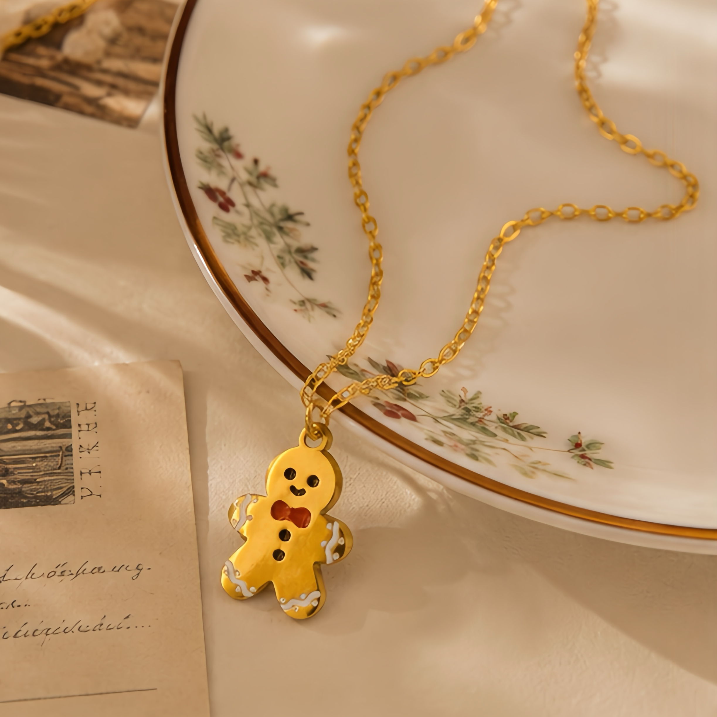 Cartoon gingerbread man oil drip pendant, collarbone chain, red bow tie, contrasting color stainless steel fine chain, Christmas season atmosphere outfit, niche decorative neck accessory Application Scenario