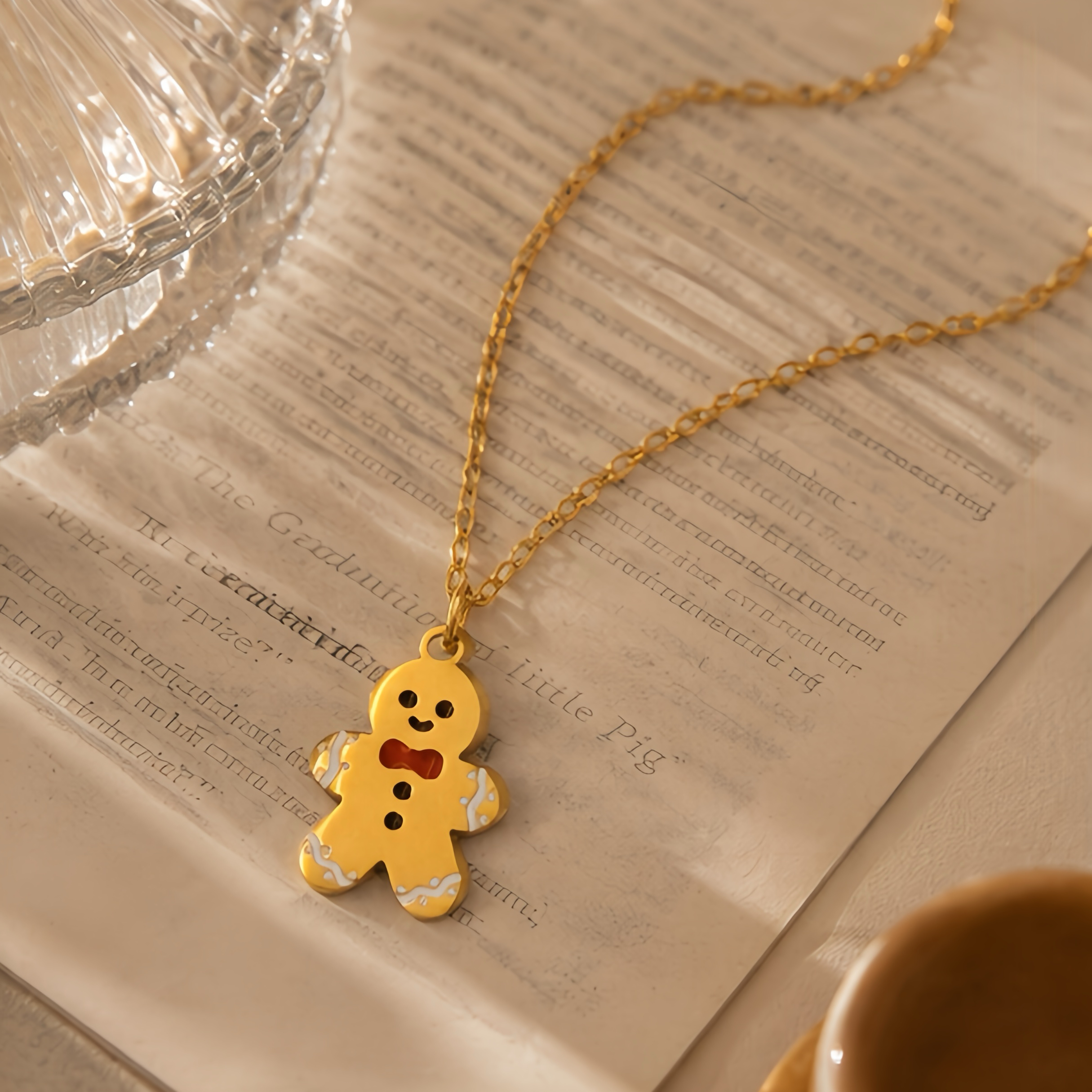 Cartoon gingerbread man oil drip pendant, collarbone chain, red bow tie, contrasting color stainless steel fine chain, Christmas season atmosphere outfit, niche decorative neck accessory Specification image