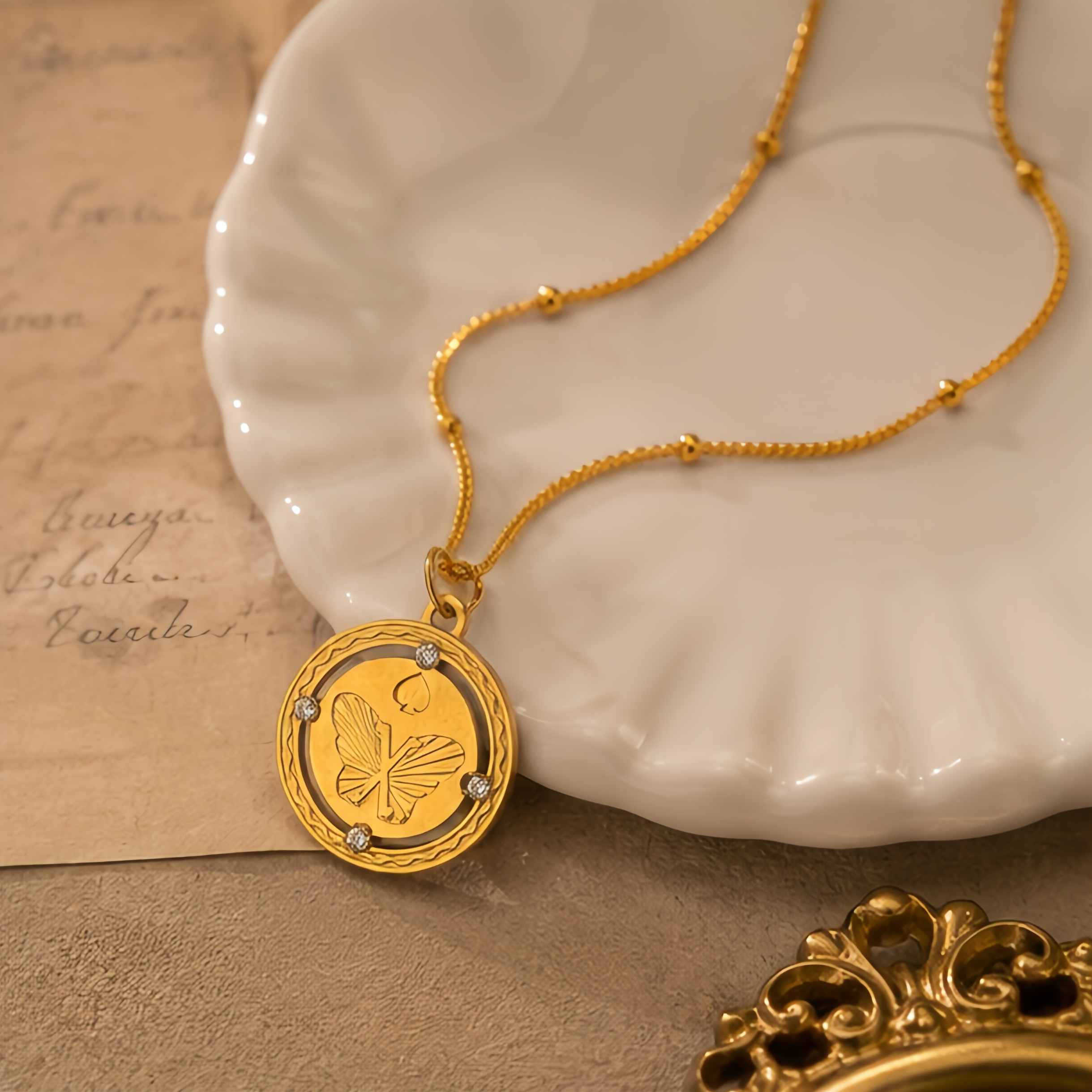 New Chinese-style relief butterfly hollowed-out round pendant, stainless steel small diamond corrugated frame snake bone chain, light mature style, niche atmosphere, daily versatile necklace Application Scenario