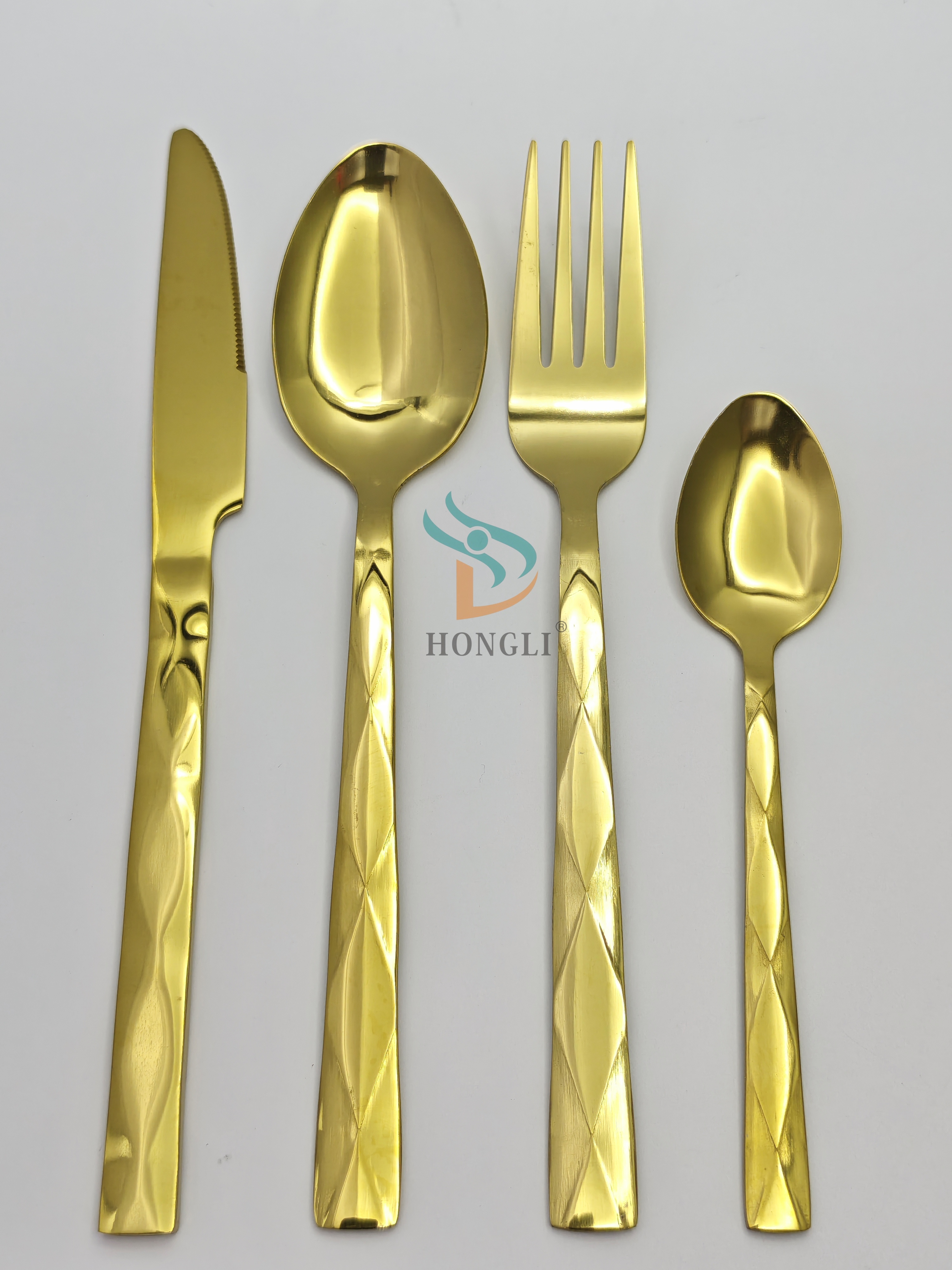 Four-piece set of golden diamond-patterned stainless steel tableware, including a knife, a tea spoon, a large spoon and a small spoon, in a black high-end gift box details Picture