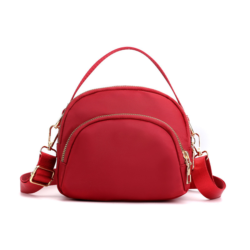 Wholesale of 2022 new women's casual single-shoulder mobile phone bags, lightweight crossbody bags, loose change hand-held shell small bags Item Picture