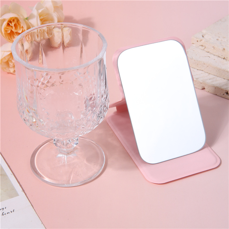 A portable small mirror for women, a simple desktop that can stand upright, ultra-mini student portable women's dressing and folding touch-up mirror Specification image