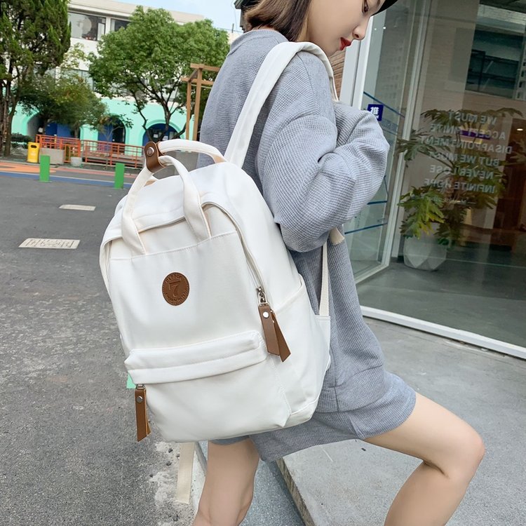 Japanese-style ins girl backpack, Korean-style junior high school student schoolbag, large-capacity solid-color nylon hand-held backpack for trendy girls Application Scenario