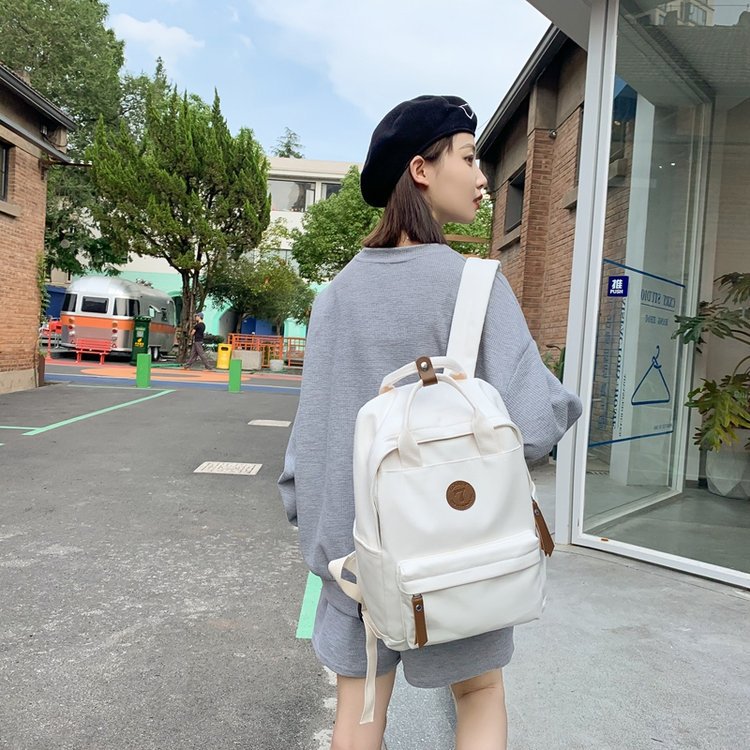 Japanese-style ins girl backpack, Korean-style junior high school student schoolbag, large-capacity solid-color nylon hand-held backpack for trendy girls Item Picture